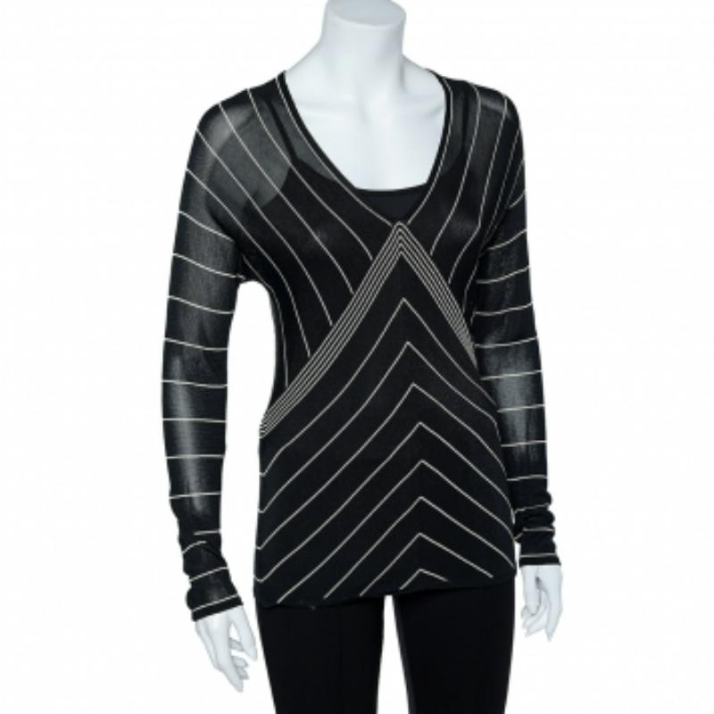 Like all other designs of the Max Mara this top also embodies femininity and a flawless silhouette. Knitted from quality fabrics, the use of white stripes on a black sheer body gives the creation an attractive contrast. It is styled with long