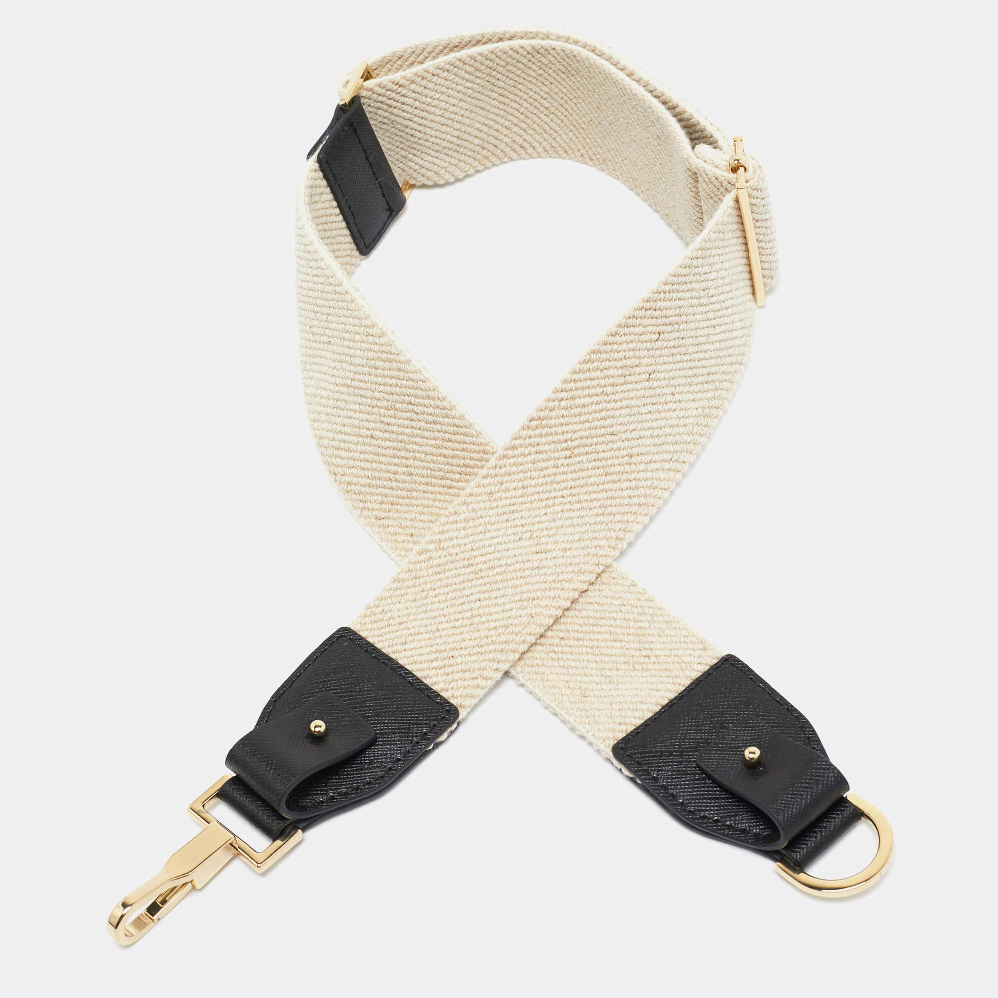 The Max Mara shoulder bag strap combines functionality with a touch of elegance. Crafted from durable canvas and supple leather it features a chic beige and black color scheme. Designed for versatility this strap offers comfort and style making it