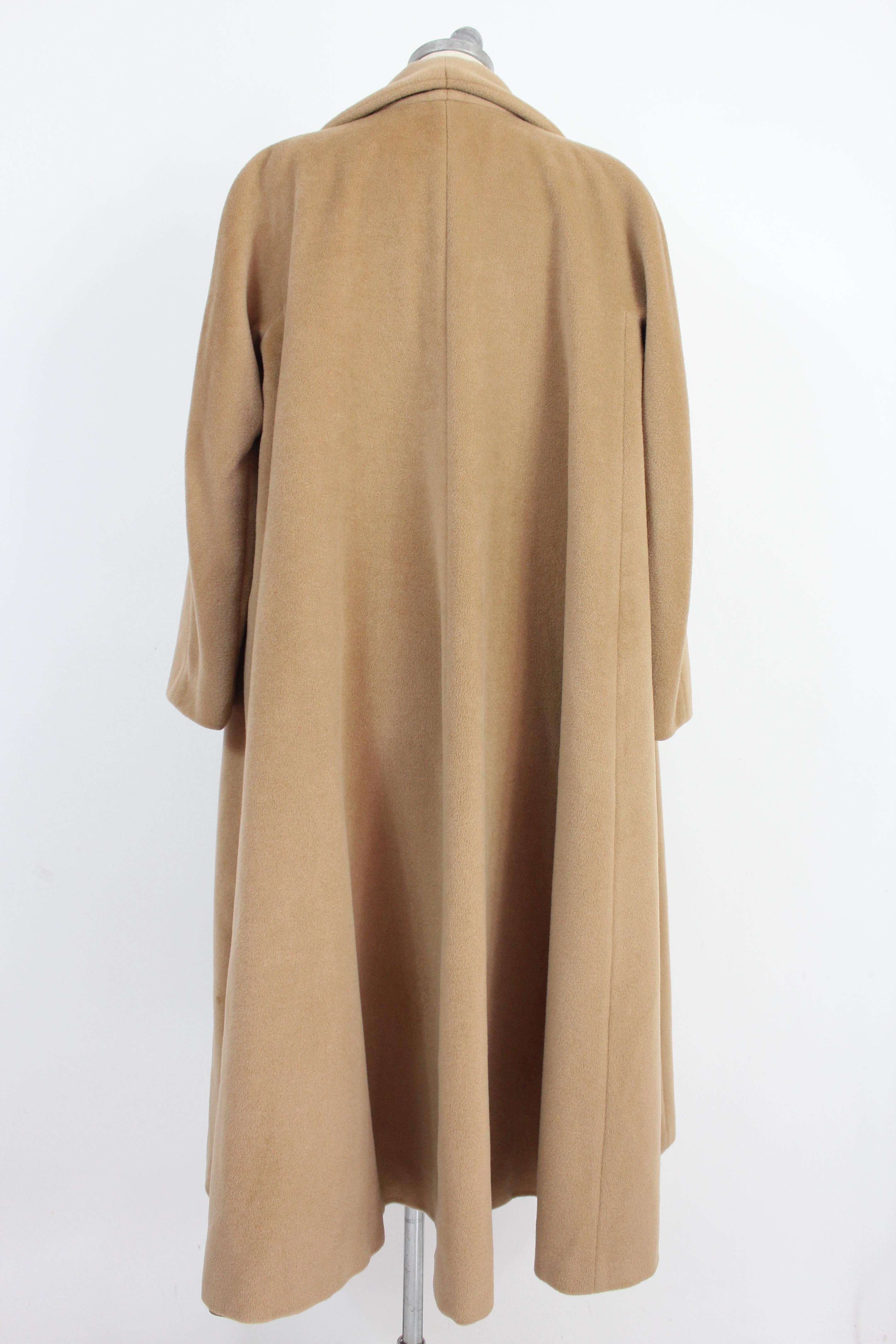 Max Mara 90s vintage women's coat. Long coat, oversized model. Beige color, 80% wool 20% cashmere fabric, internally lined 100% viscose. Made in Italy.

Condition: Very good.

This item is preloved and remains to be in a very good condition. There