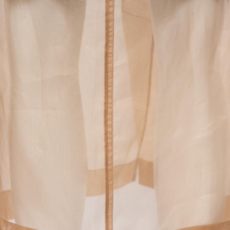 Fall in love with the elegance and craftsmanship of this Max Mara beige pencil skirt. Designed with silk, the sheer skirt is equipped with four external pockets and zip closure at the front. Sheer skirts are undoubtedly edgy, fashion-forward, and