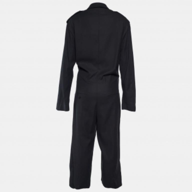 Mit diesem Jumpsuit von Max Mara machen Sie bei jedem formellen Meeting oder Event einen umwerfenden und zugleich raffinierten Eindruck. Der aus schwarzem Baumwollstoff genähte Jumpsuit hat eine weit geschnittene Silhouette mit langen Ärmeln und