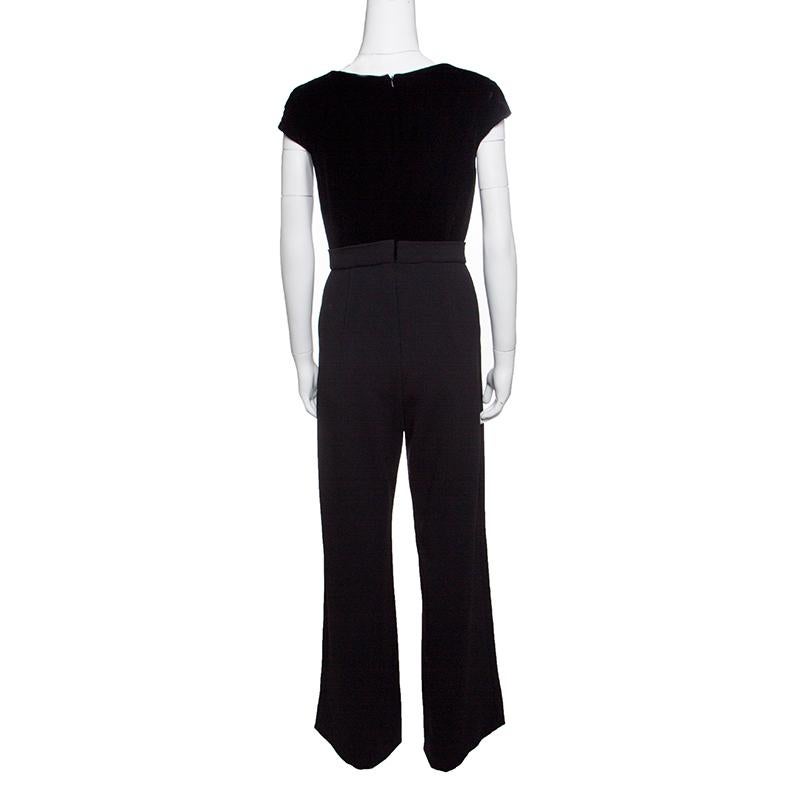 What's not to love about this jumpsuit from Max Mara! In a black shade, it flaunts a velvet bodice and a contrast bottom with wide legs. A pair of glossy high heels will complement the jumpsuit beautifully.

Includes: The Luxury Closet Packaging,