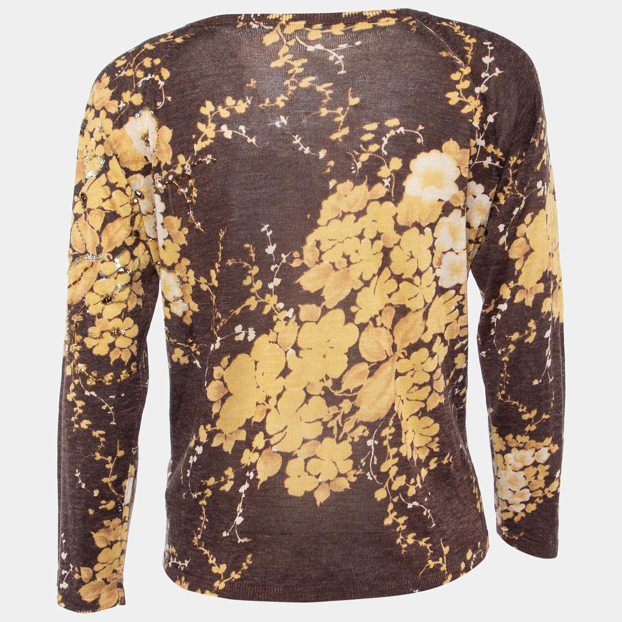 Dieses Designertop bietet Stil und Komfort. Die Kreation wurde aus den besten Stoffen geschneidert und mit vielen Details versehen. Kombinieren Sie es mit einem Rock und Absätzen.