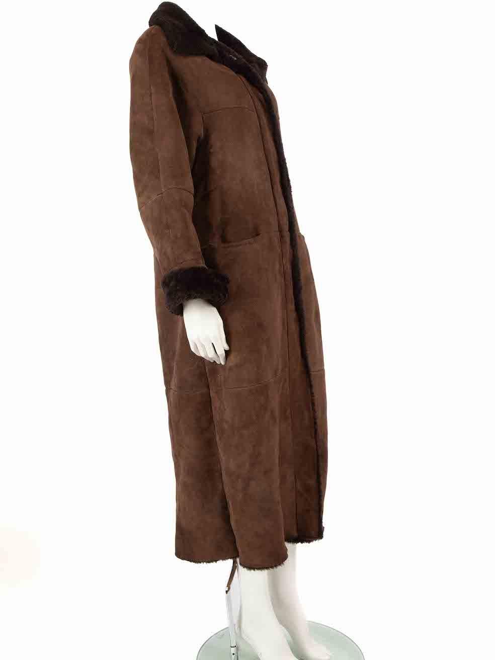 CONDITION is Good. General wear to coat is evident. Moderate signs of wear to the exterior with marks and abrasions on suede. Balding to shearling cuffs and wear to the internal lining with leather seams splitting. Missing composition label on this