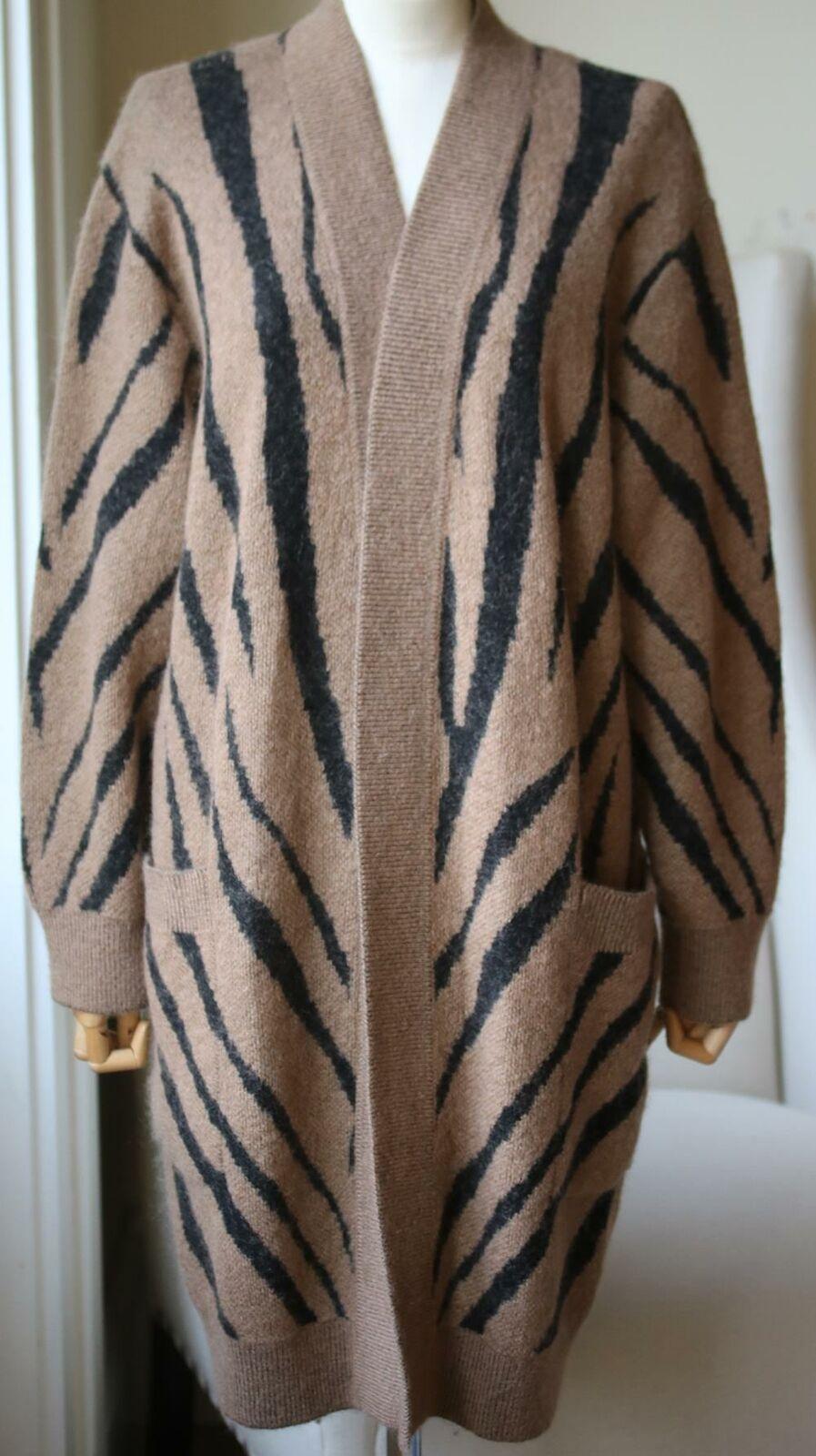 Spun with touches of soft wool and mohair, this 'Carlo' cardigan is covered in graphic zebra stripes. Brown and black mohair, viscose, polyamide, polyester and wool-blend. Slips on. 34% Mohair, 26% viscose, 18% polyamide, 16% polyester, 6% wool.