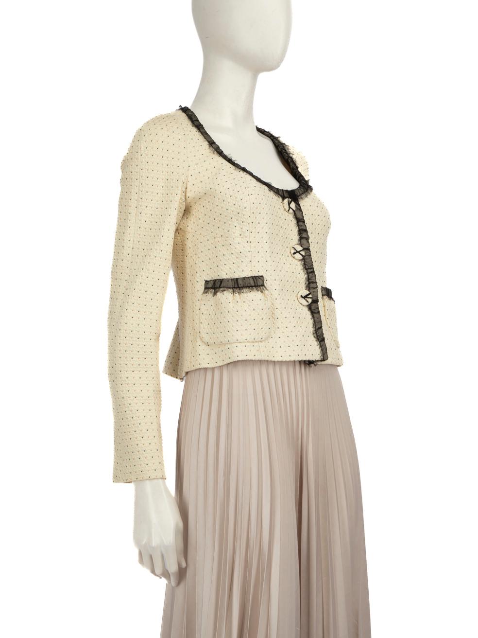 CONDITION is Very good. Minimal wear to the jacket is evident. Discolouration on two of the poppers on the left side and on the bottom popper cover on the right side, right neckline, both cuffs and on the back of the lining. Plucks to the weave on