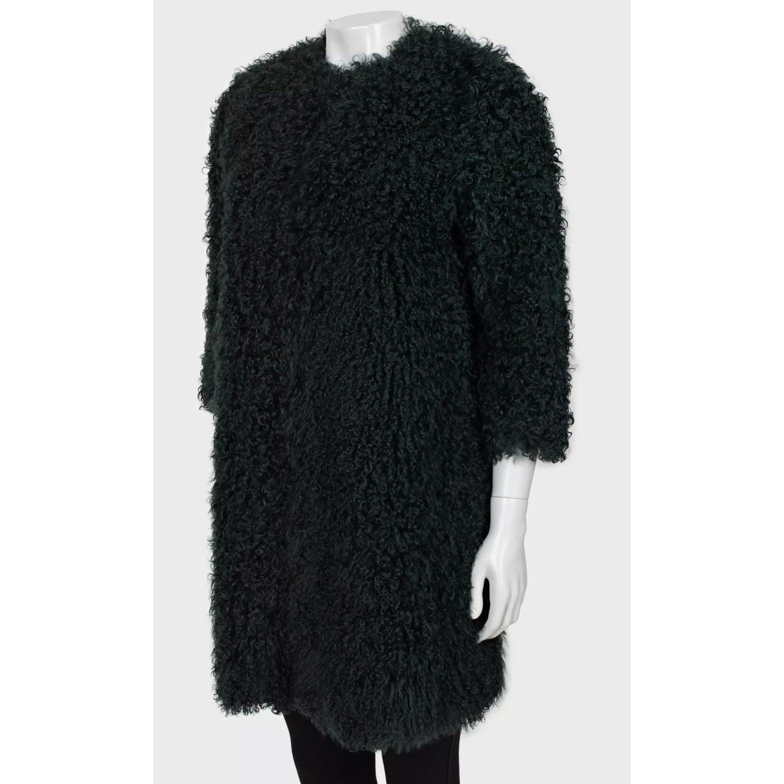 Elevate your wardrobe with this exquisite Max Mara coat, a true statement piece! 
Crafted from luxurious natural karakul fur, this coat exudes sophistication and timeless elegance. 
The rich dark green color adds a touch of uniqueness, making it a