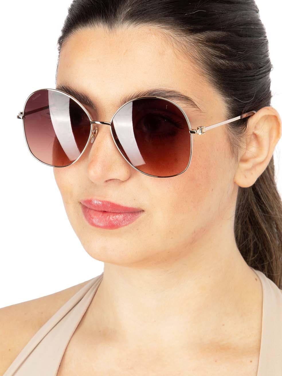CONDITION is New with tags on this brand new Max Maradesigner item. This item comes with original packaging.
 
 
 
 Details
 
 
 Model: MM 0034 30F 60
 
 Gold
 
 Metal
 
 Aviator Eye Sunglasses
 
 Gradient Brown Lens
 
 Branding at the arms
 
