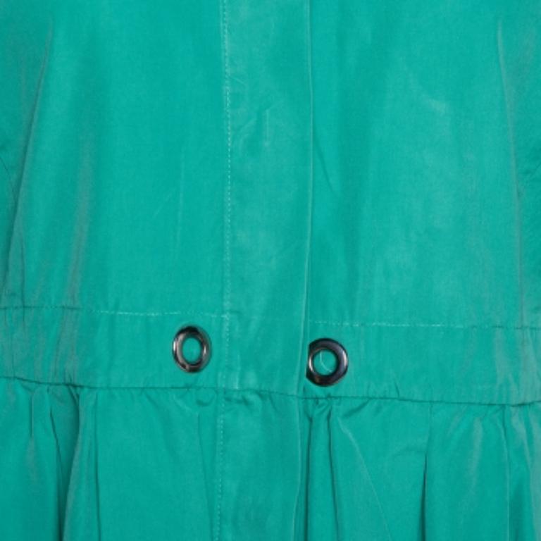 This lovely Max Mara dress will look amazing with statement accessories. It is made of 100% cotton in a shirt style and features pleats below the waist. It comes with concealed buttons and flaunts sharp collars and long sleeves.  Pair it with