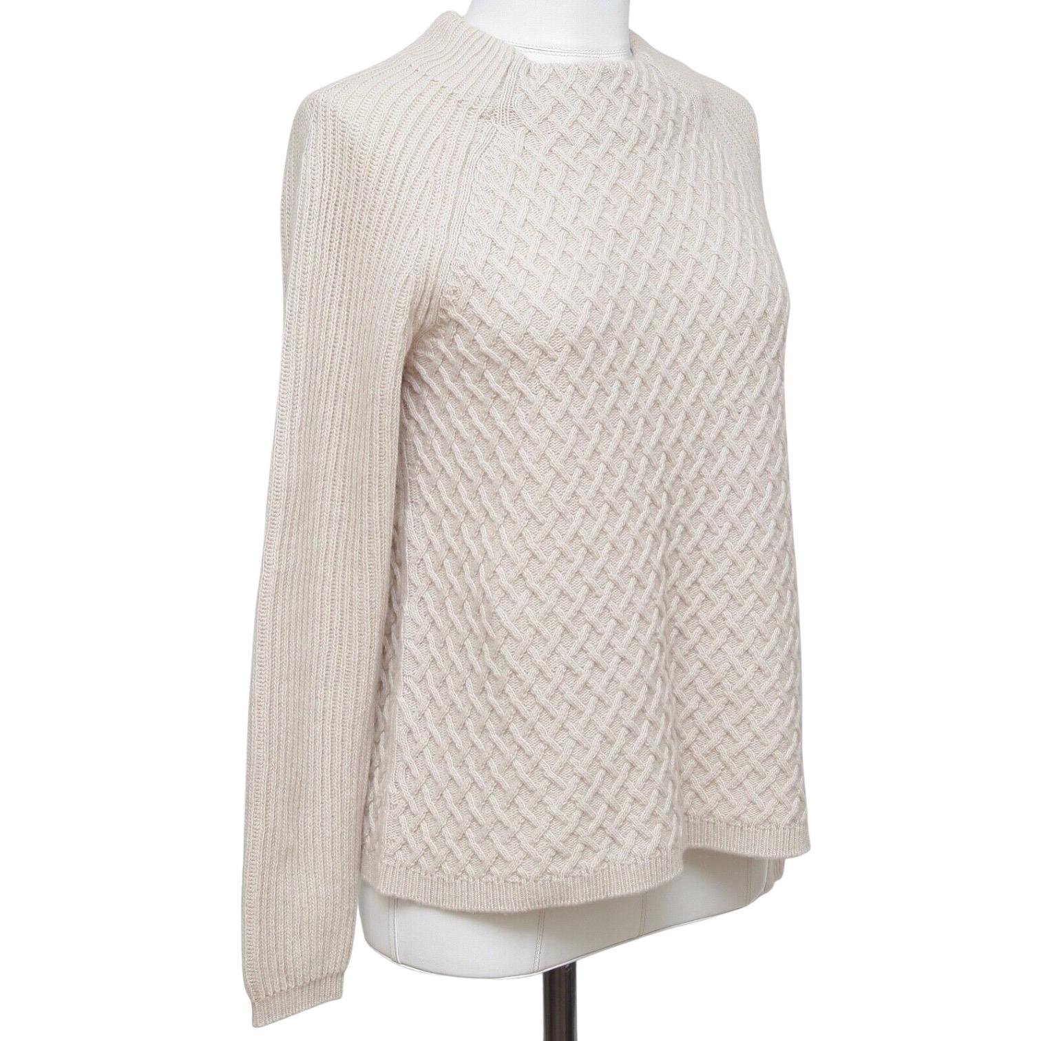 GUARANTEED AUTHENTIC MAX MARA SWEATER

Design:
• Textured beige moc turtleneck sweater.
• Long sleeve.
• Pullover.
   
Size: S

Material: 90% Wool, 10% Cashmere

Measurements (Approximate Laid Flat, Give To Knit):
• Shoulder to Shoulder, 19