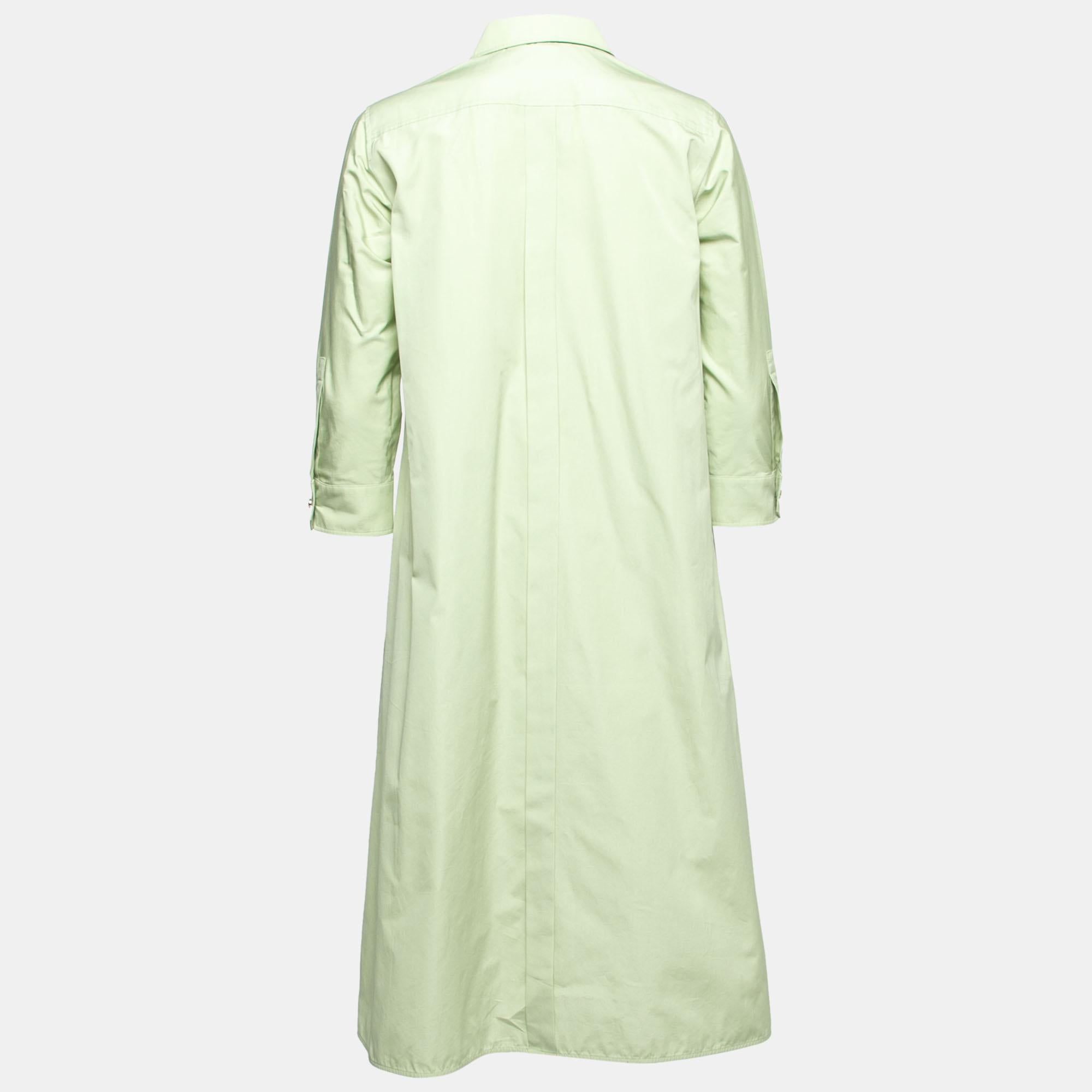 Max Mara brings you this shirt dress to incorporate elegance and class into your attire. It is designed using light-green cotton fabric. It flaunts four pockets and buttoned closure. Look stylish as you wear this shirt dress.

