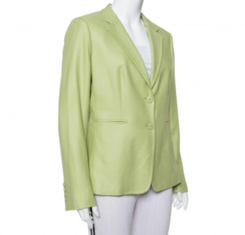 This Max Mara blazer is a staple piece for smart formal styling. It comes wonderfully tailored from a luxurious wool-blend and detailed with lapels, button closure, and pockets. Give your apparel collection a new update with this light green blazer.