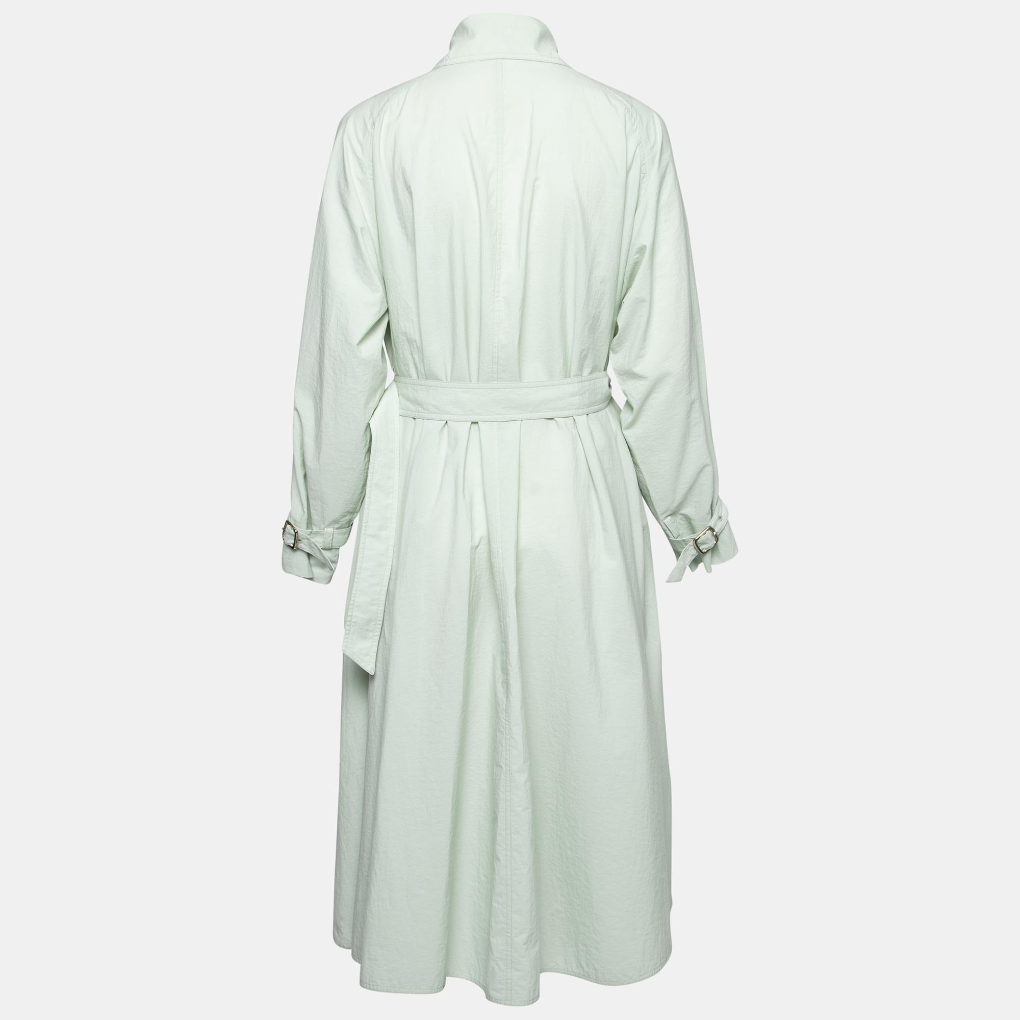 Trench coats are an important everyday accessory that combines fashion and functionality effortlessly. And this trench coat from Max Mara is no different. Providing an aura of ease and high style, this double-breasted coat is cut from mint-green