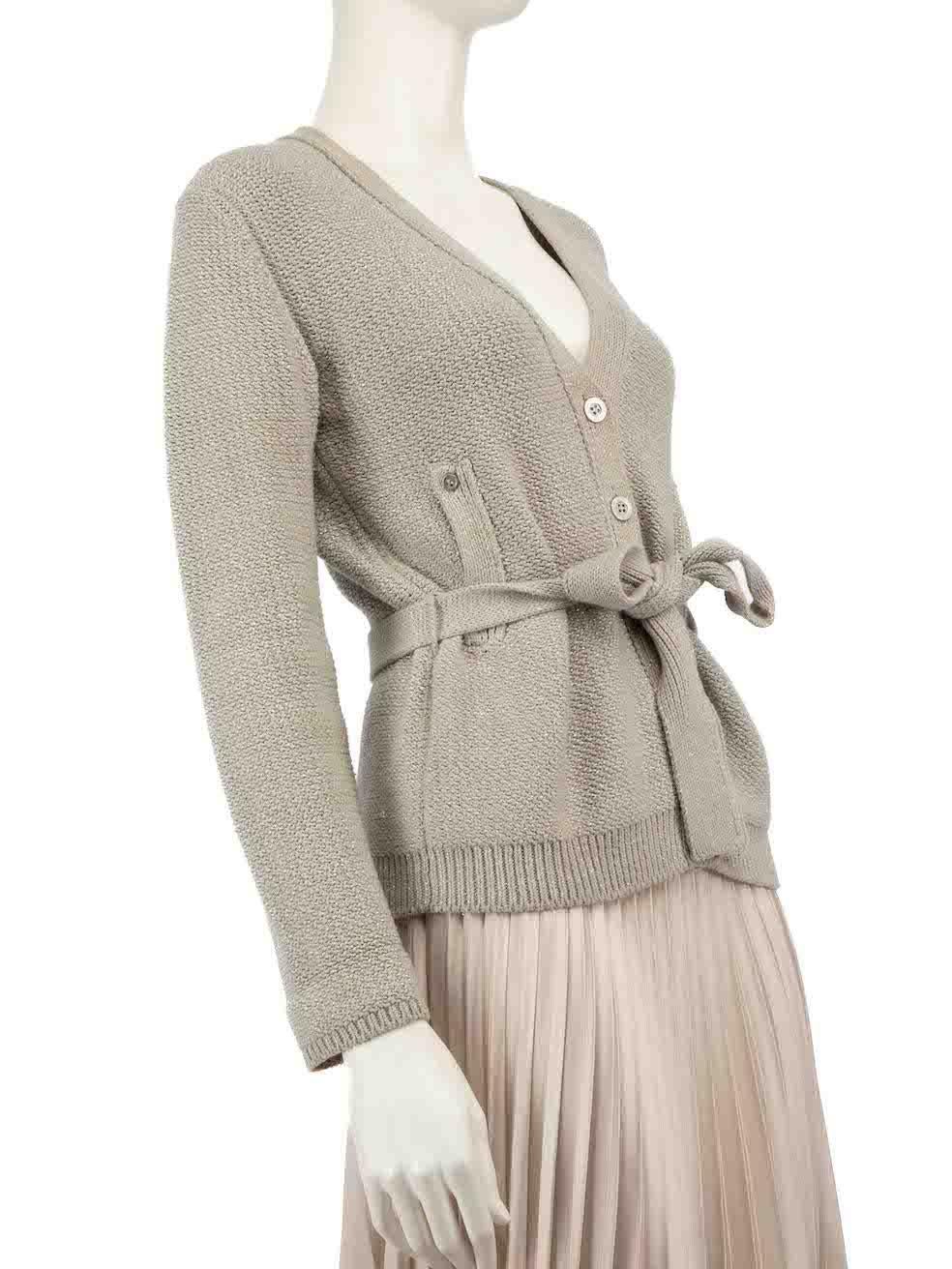 CONDITION is Very good. Minimal wear to cardigan is evident. Minimal wear to the cuff area on the left sleeve where discolouration can be seen on the inside and outside, pull to weaves on the right and left sleeves, tarnishing to the bottom button