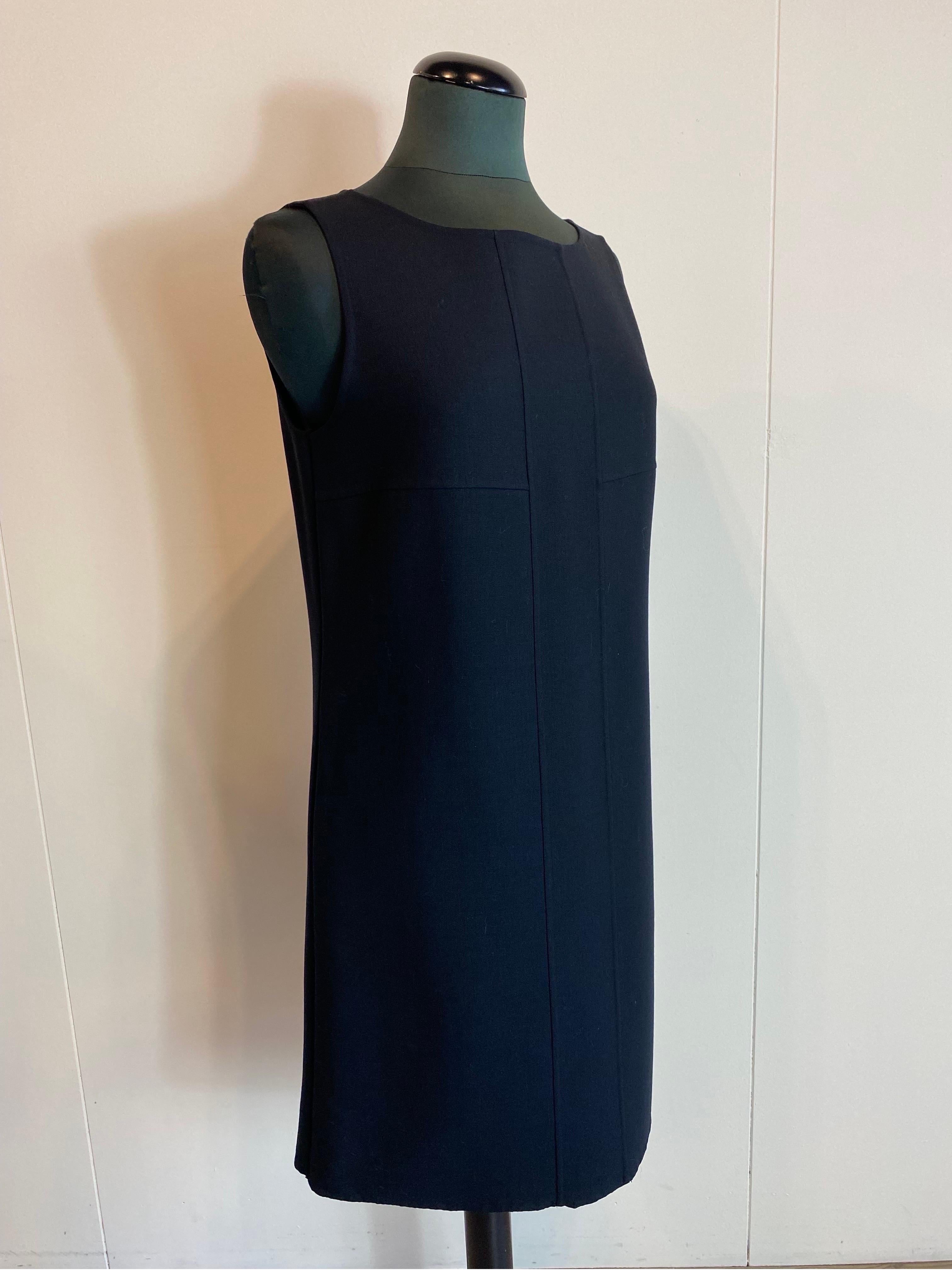 Max Mara Studio black sheath dress
No composition label considers it to be a wool blend.
Very simple basic sheath dress and nice cut. 
Wide shoulder sleeveless. Straight cut.
Size not shown, we consider it to be a 44 Ita.
Breast 50.
Bust