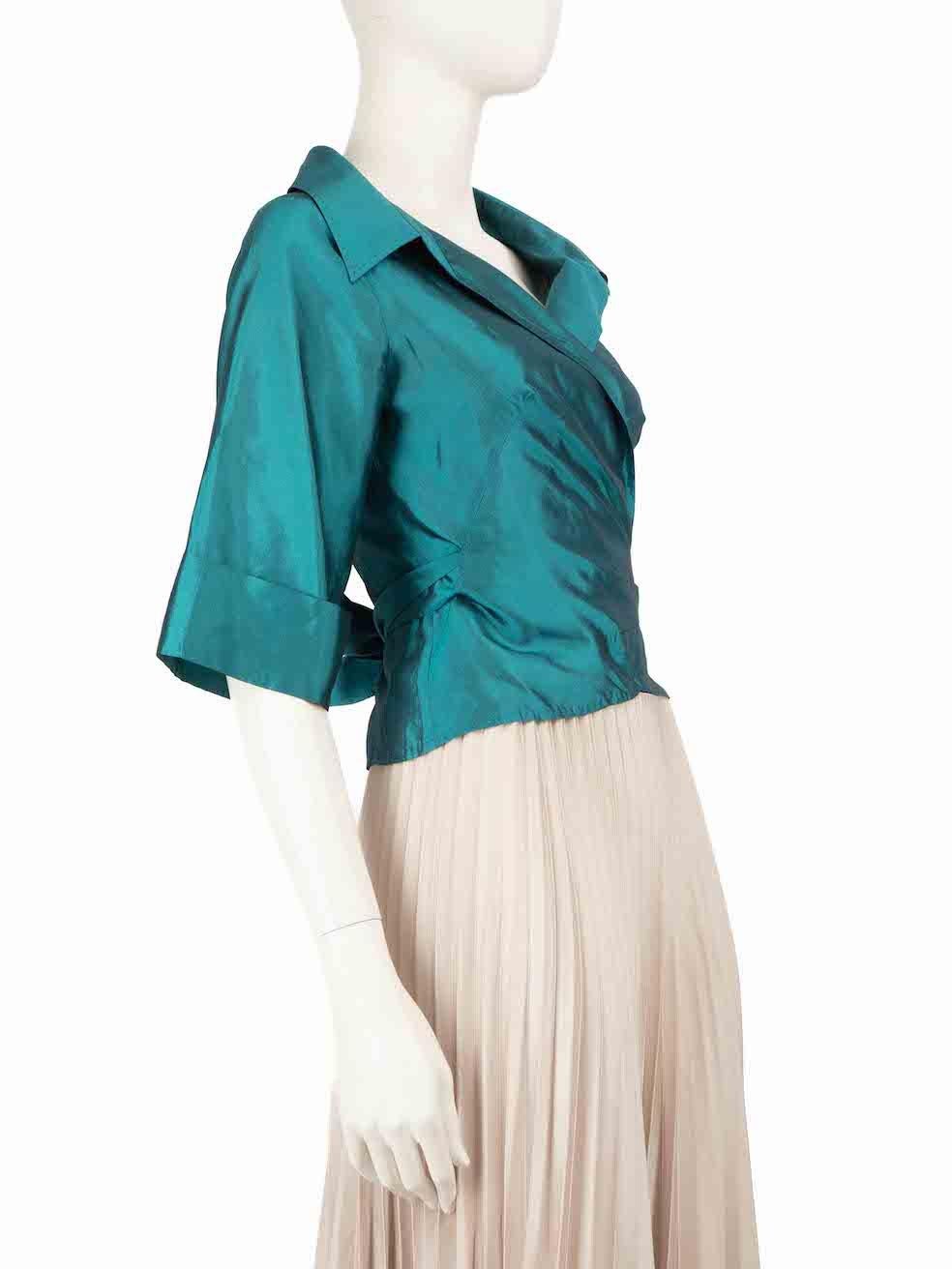 CONDITION is Very good. Minimal wear to the shirt is evident. There is slight discolouration on the right underarm on this used Max Mara designer resale item.
 
 
 
 Details
 
 
 Teal
 
 Silk
 
 Shirt
 
 Mid length sleeves
 
 Wrap tie fastening
 
 

