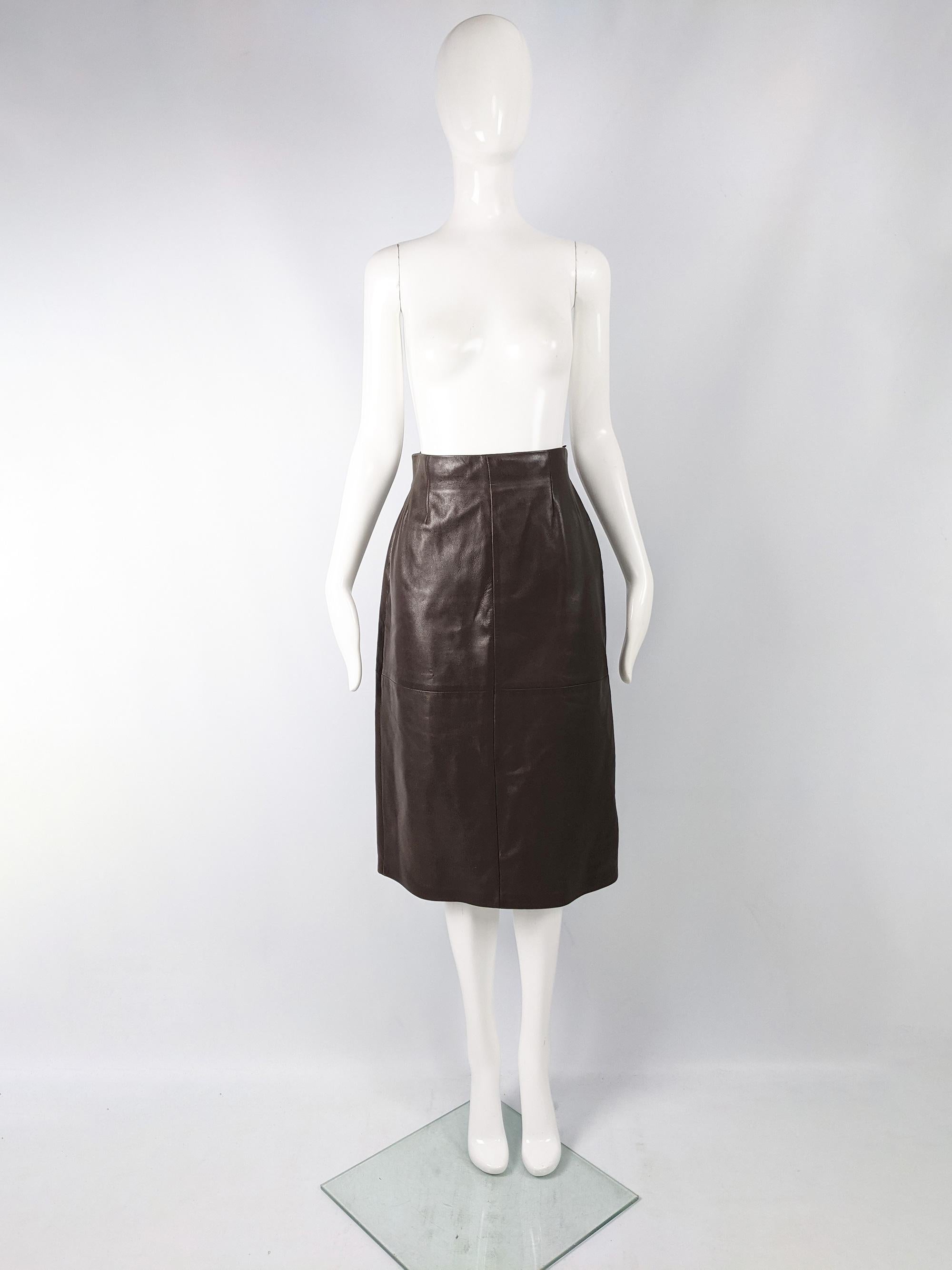 A buttery soft vintage women's leather skirt from the 90s by luxury Italian fashion house, Max Mara. Made in Italy from a dark brown leather with a classic A line shape which allows it to go with any outfit. 

Size:  Marked IT 44 but runs a little