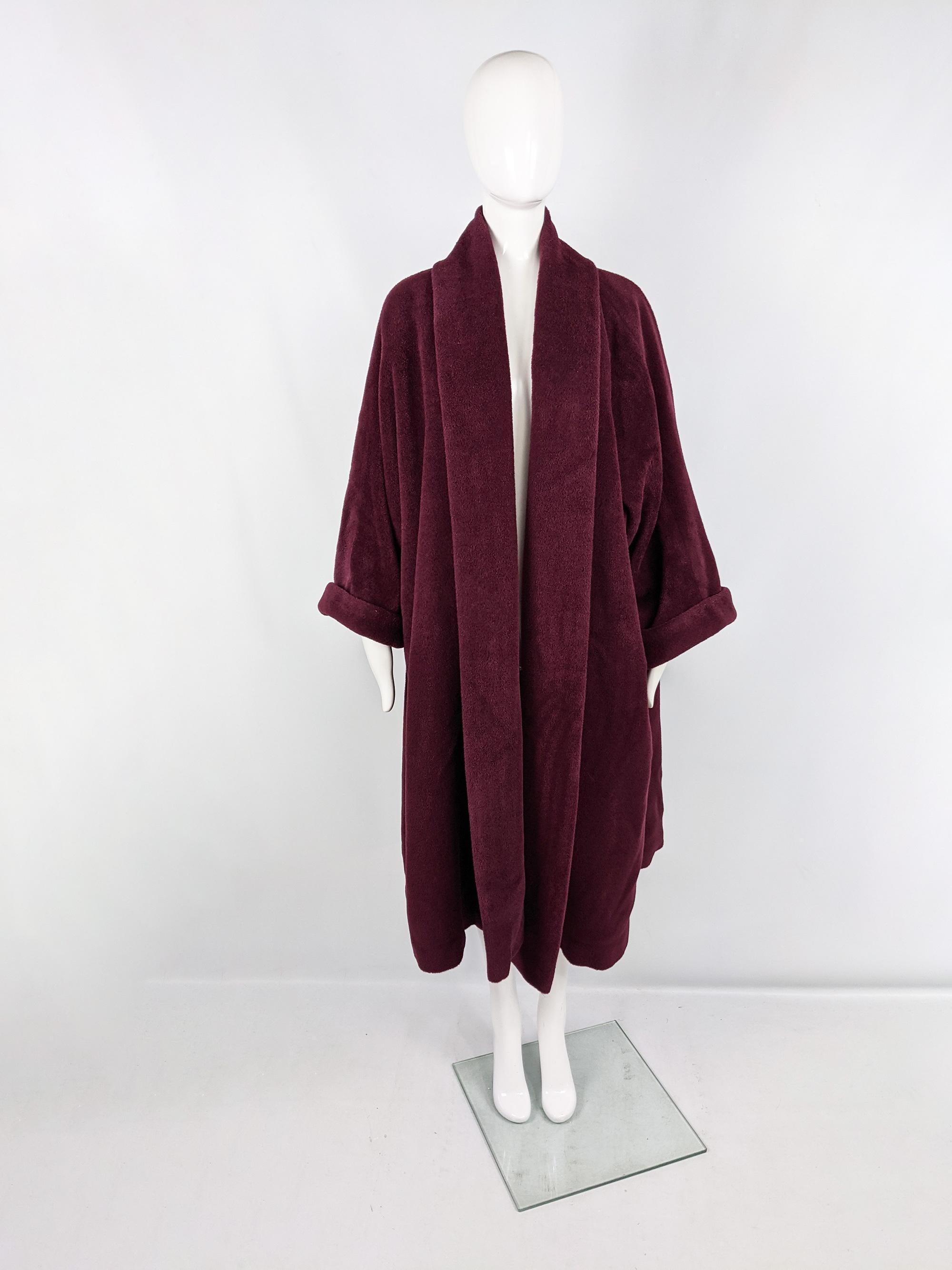 An incredible vintage Max Mara maxi swing coat from the late 80s / early 90s. Made in Italy from yards of luxuriously soft, Alpaca, mohair and wool blend fabric with great weight due to the amount of fabric. It is an edge to edge style with an open