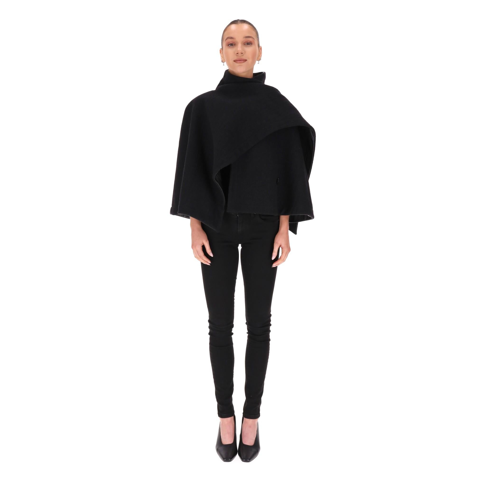 Max Mara Virgin Wool Cape

Black cape fully crafted from virgin wool with high neck and wrap design with button closure.

Rrp Approx. £1,800

Size – 36FR

Condition – Very Good

Composition – 100% Virgin Wool