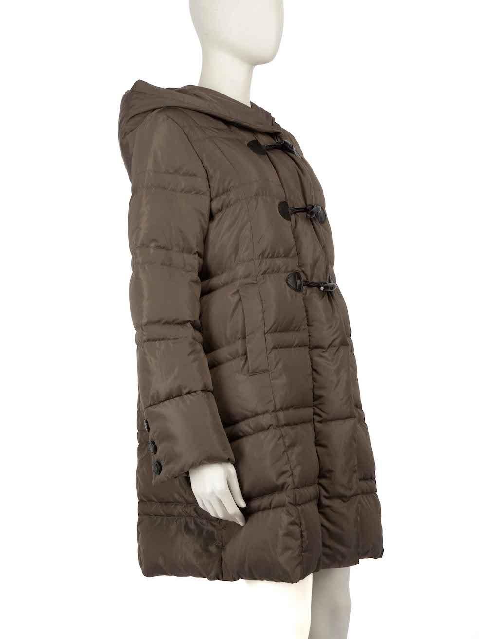 CONDITION is Very good. Minimal wear to coat is evident. Minimal wear to the leather toggle fastenings with creasing and slight peeling, leather button hole with abrasions and small discolouration on the front right on this used Weekend Max Mara