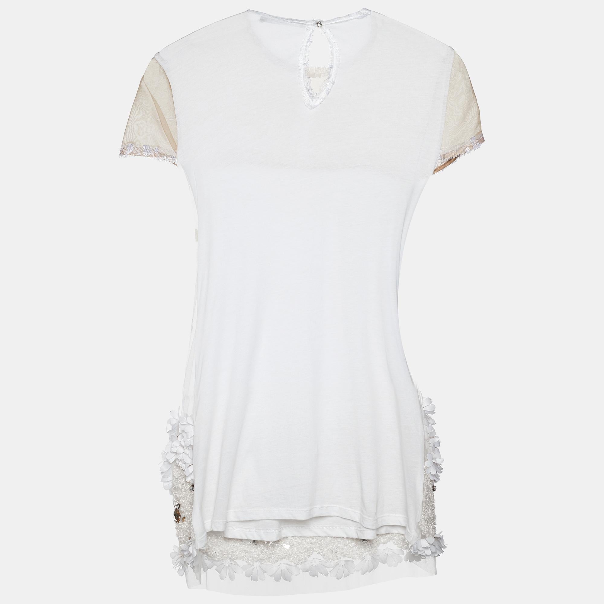 This top from Max Mara is the best pick to look stylish. Stitched using white mesh fabric, this top features crystal and sequin embellishments. It comes with a buttoned closure and short sleeves. Team it up with jeans to step out for casual