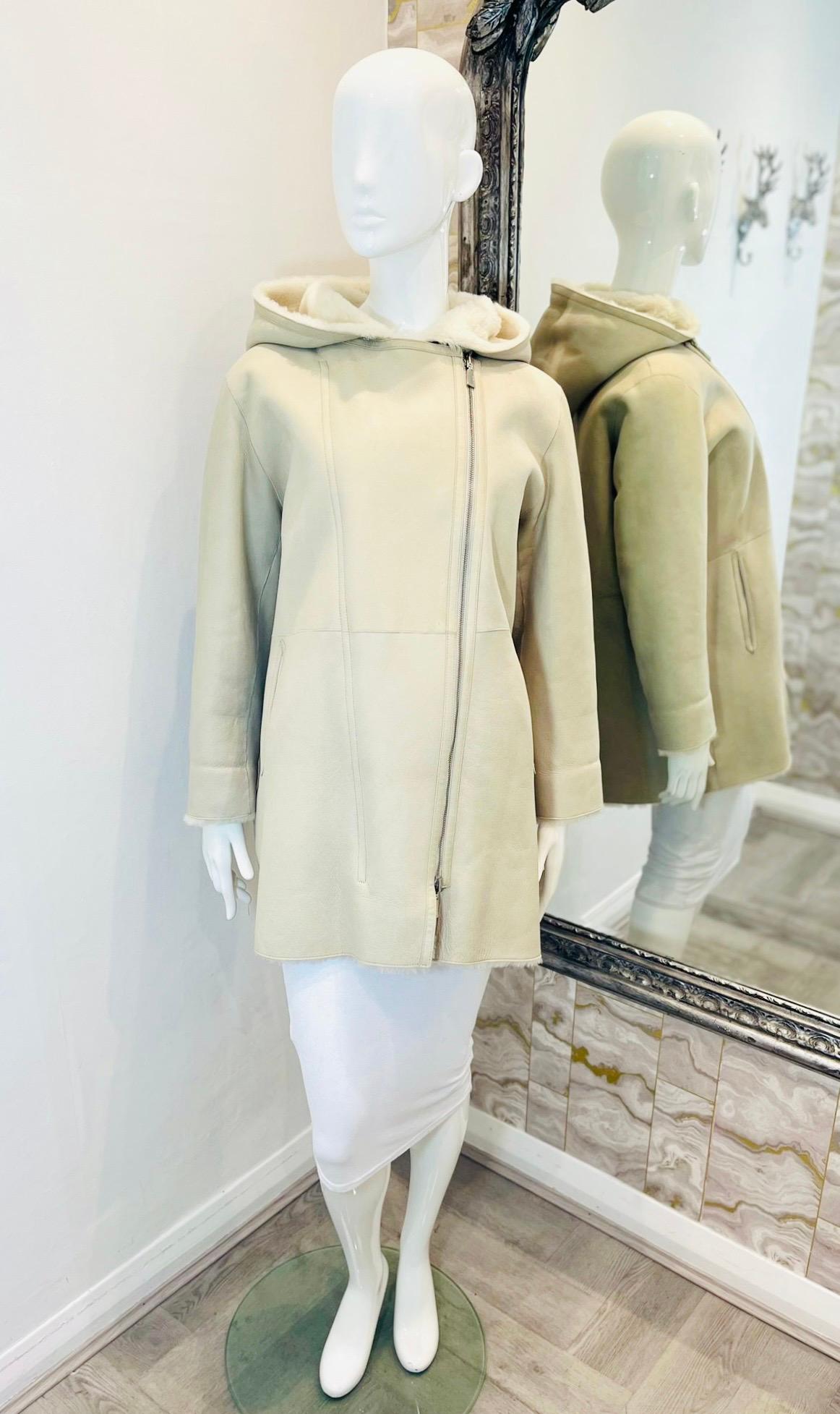 Max & Moi Reversible Merino Shearling Coat

Ivory, longline coat designed to be worn either on the leather side, or reversed to have the plush shearling lining facing outwards.

Featuring front asymmetric zip fastening, side pockets and spacious