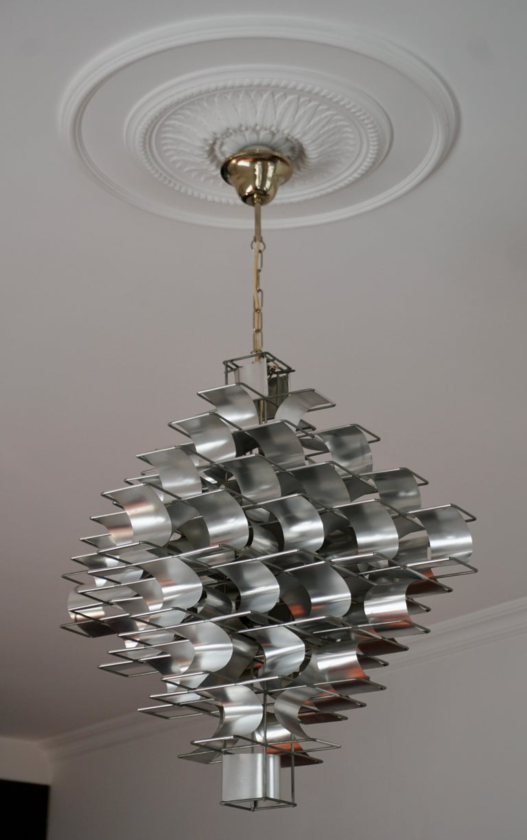 An aluminium and steel chandelier “Cassiopé”, designed in 1969 by Max Sauze and produced by Atelier Sauze in the 1970s. Originally this chandelier was designed for the Congress Center in Aix en Provence. The Cassiopé is commercially produced in two