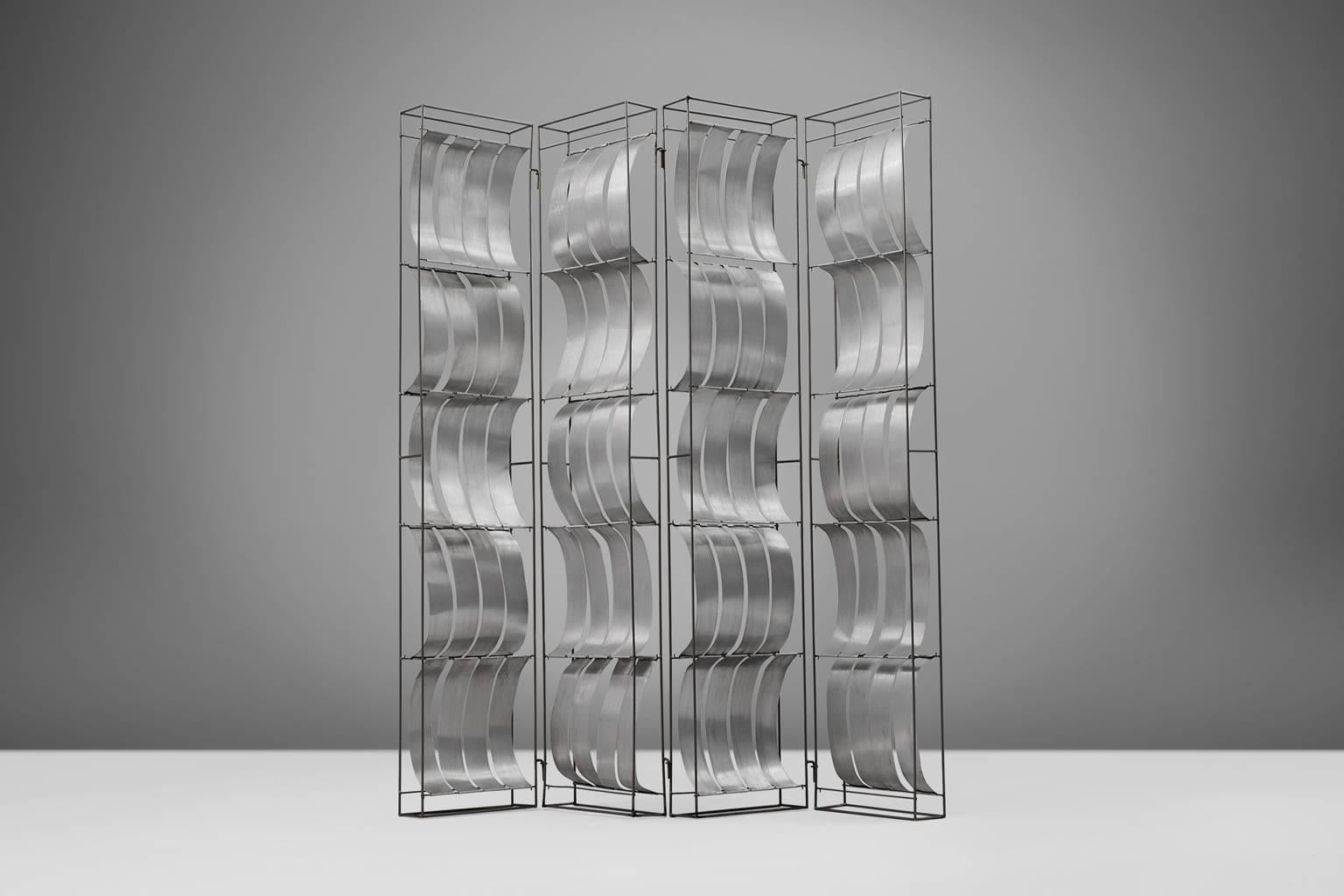 Max Sauze, room divider, aluminium, by France, 1970s. 

Extremely rare room divider by French designer Max Sauze. The light weight aluminium elements in the foldable frame, are placed both convex as concave. This creates a beautiful 3-dimensional