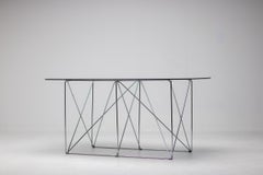Max Sauze Foldable Smoke Glass Dining Table – A Masterpiece of Minimalist Design