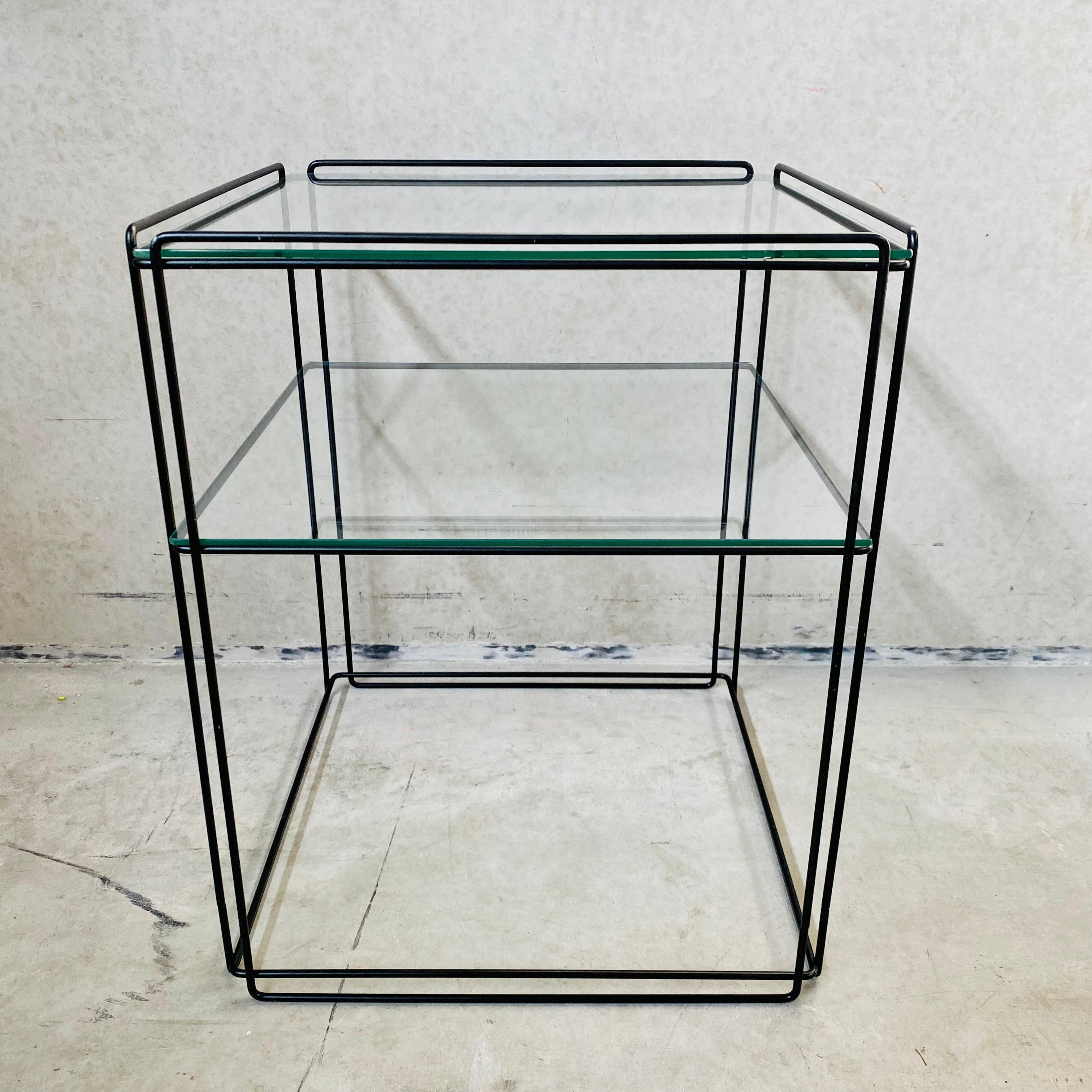 MAX SAUZE FOR ATROW ' ISOCELE' SIDE TABLE, 1970'S
This graphical side table, model 'Isocele', was designed by Max Sauze in France in the 1970's. It has a black enameled steel frame with 2 glass plates. A beautifil design that gives an airy effect