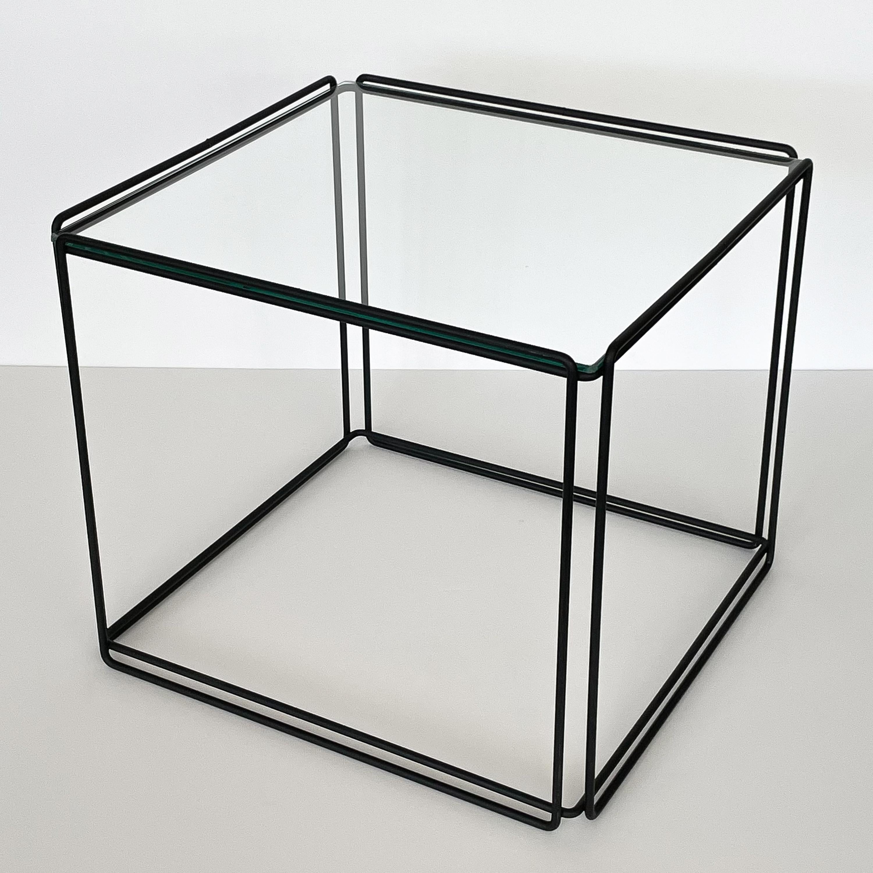A minimalist metal and glass Isosceles cube side table by Max Sauze for Attrow, France, circa 1970s. Black painted welded wrought iron metal frame with inset 1/4