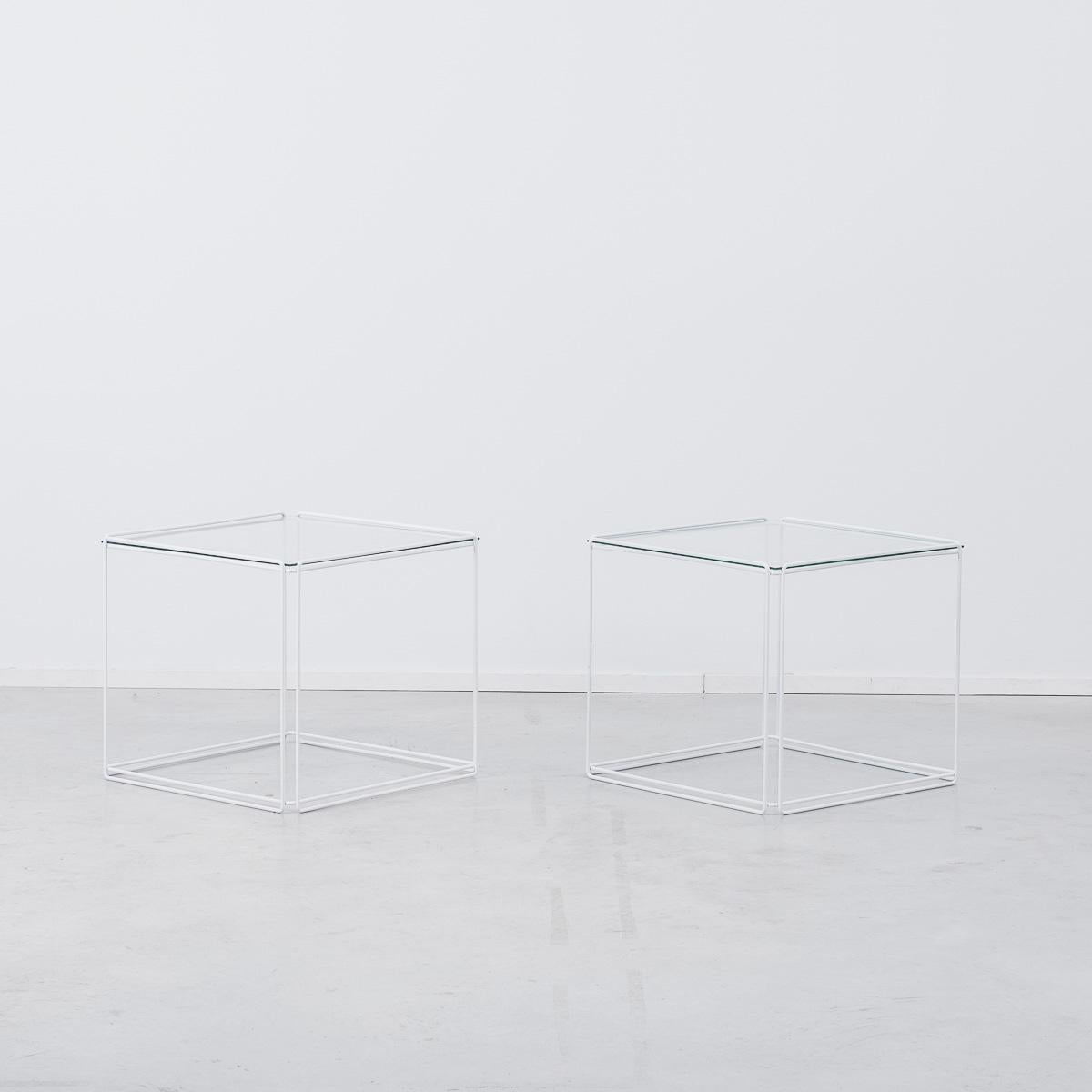 A set of Minimalist side tables by French artist Max Sauze, circa 1968. Geometric and sculptural, the wire frames give these tables a transparent quality. Constructed with off white enameled steel and glass. Very good condition besides some light