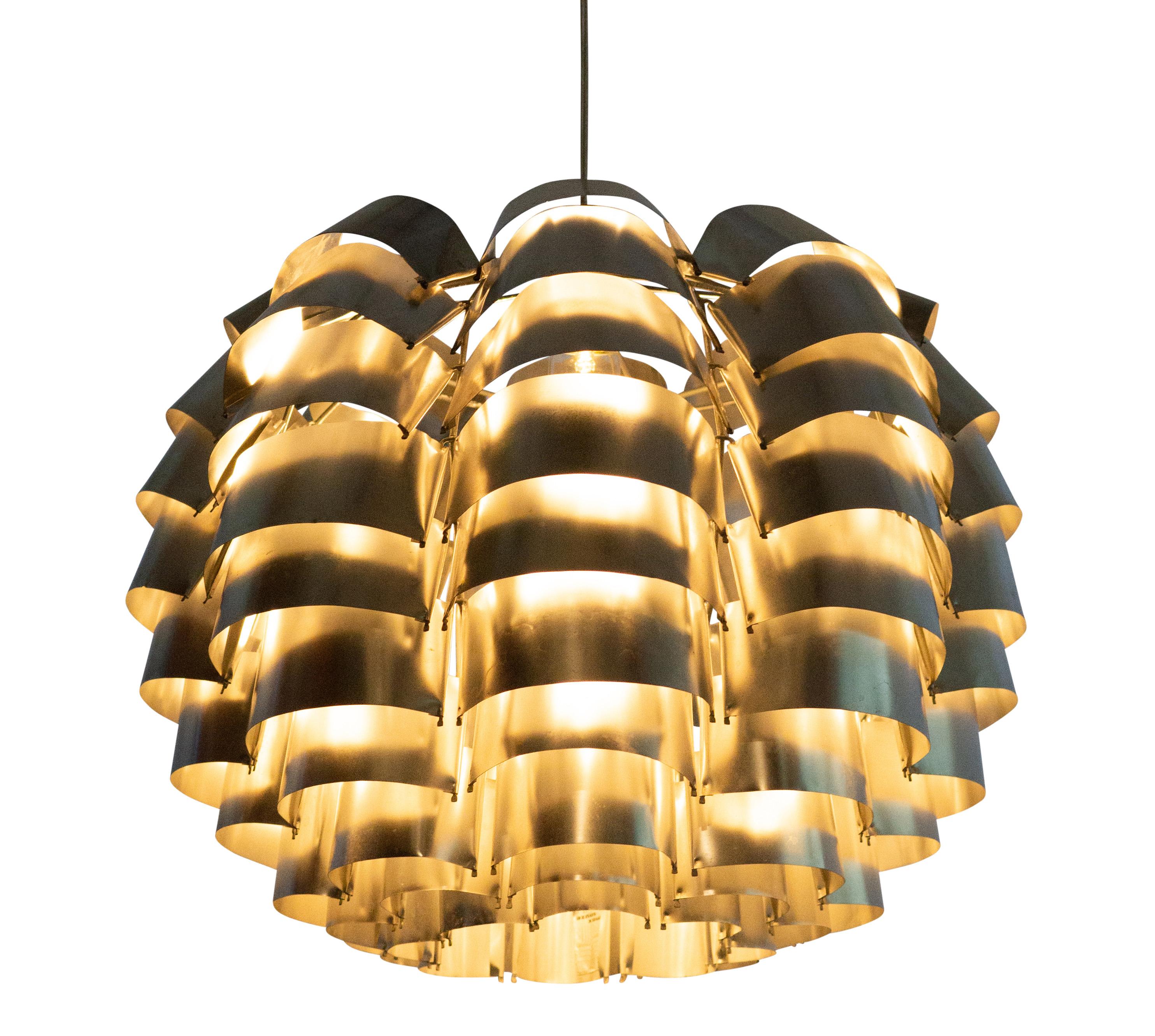 Max Sauze model “Orion” ceiling light. 1969 designed in France by metal craftsman Max Sauze. He is well know in the interior design world for his work with bend metal plates and naming the pieces after zodiacs.