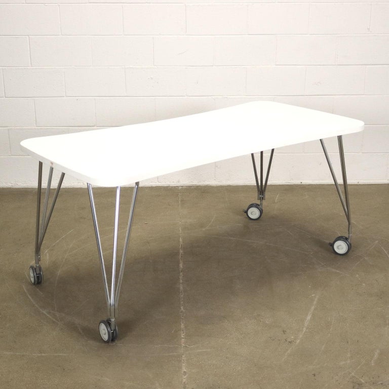 Table / desk, metal base with wheels, laminate top.