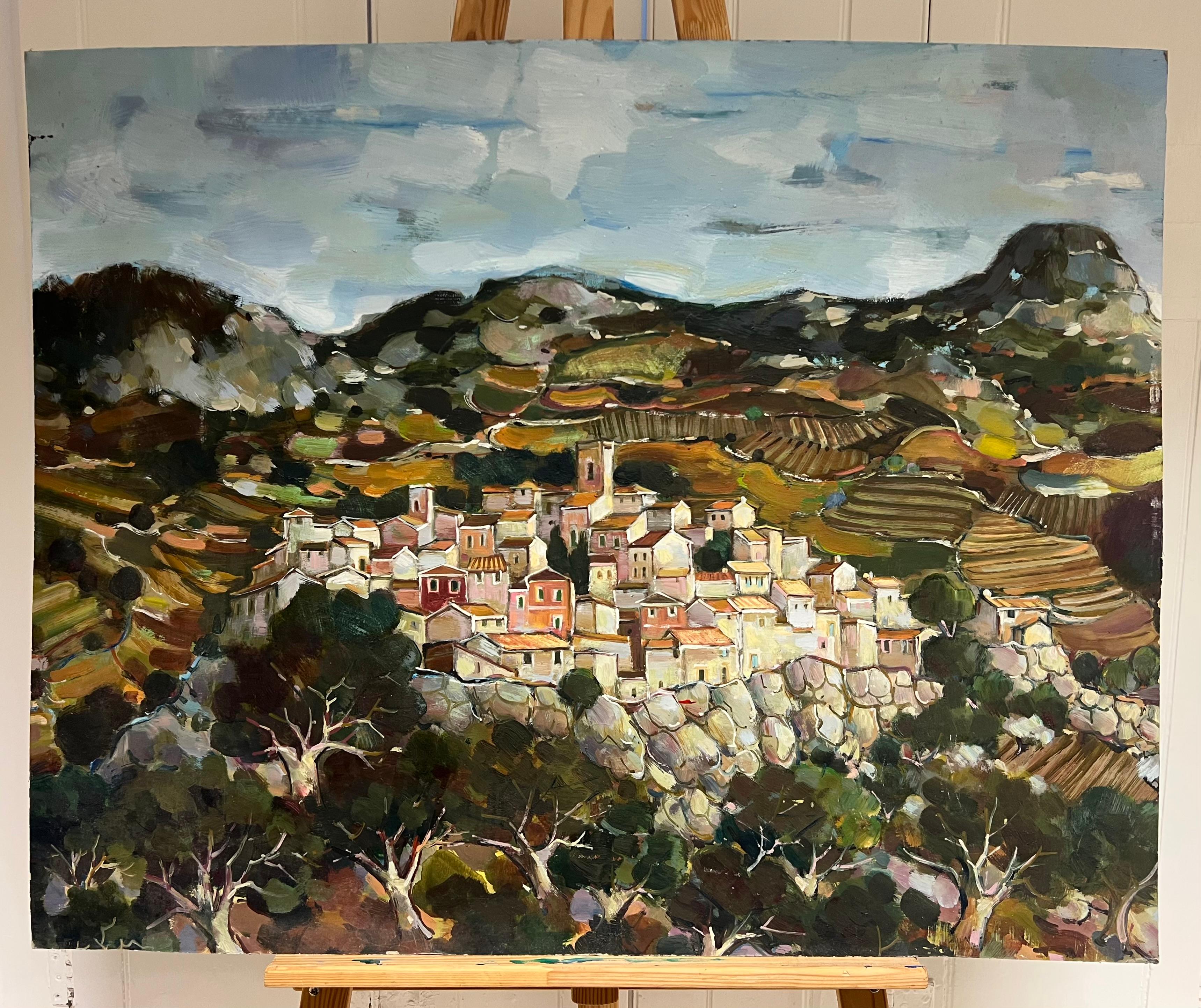 A Hilltop Village Amid Rolling Hills and Rocky Terraces Cloudy Sky Landscape - Painting by Max Toutain