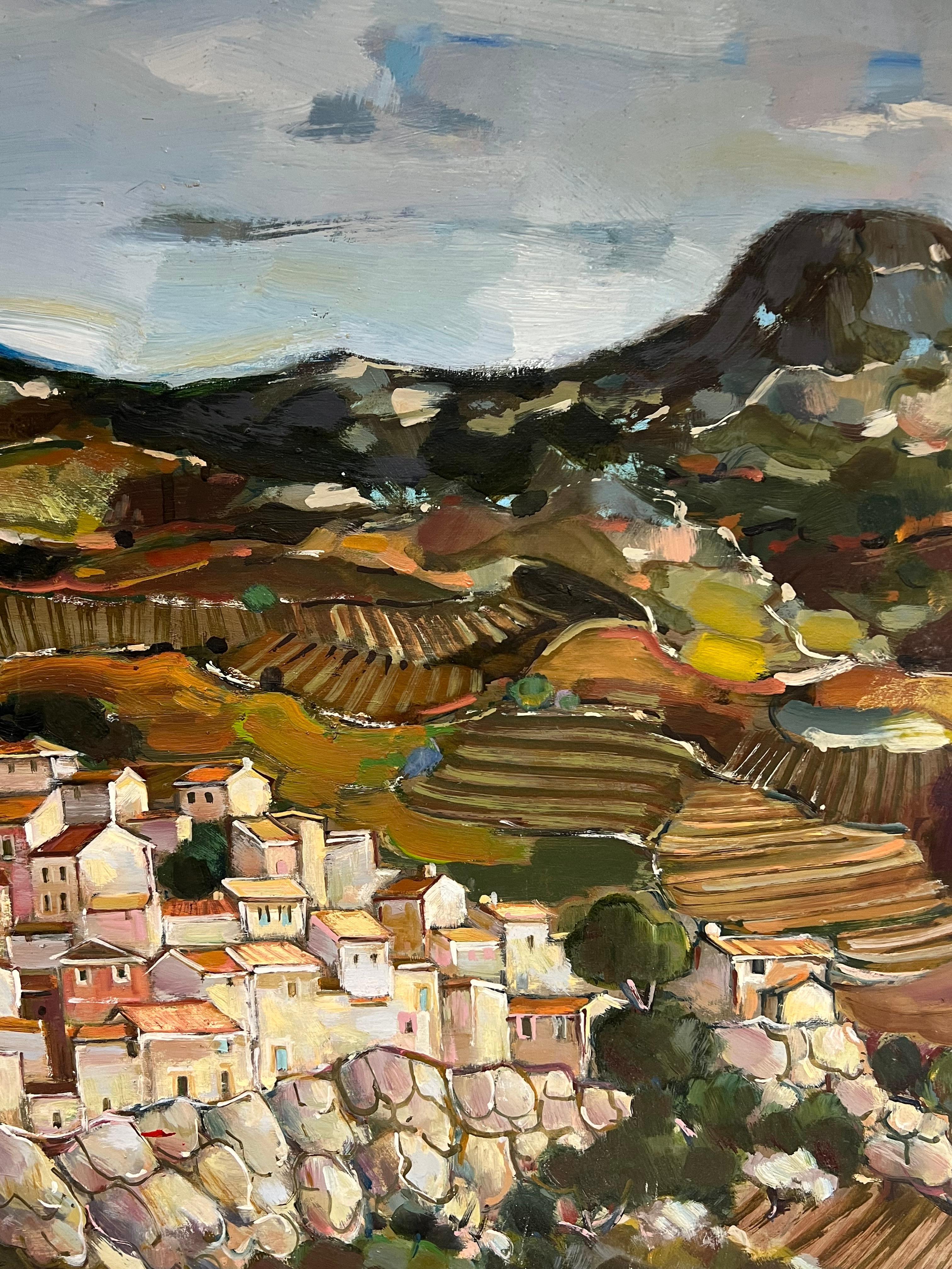 A Hilltop Village Amid Rolling Hills and Rocky Terraces Cloudy Sky Landscape - Post-Impressionist Painting by Max Toutain