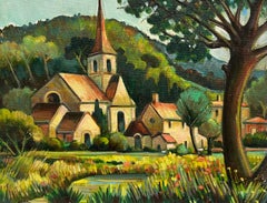 Pintoresca iglesia de pueblo enclavada en medio de un exuberante paisaje campestre francés