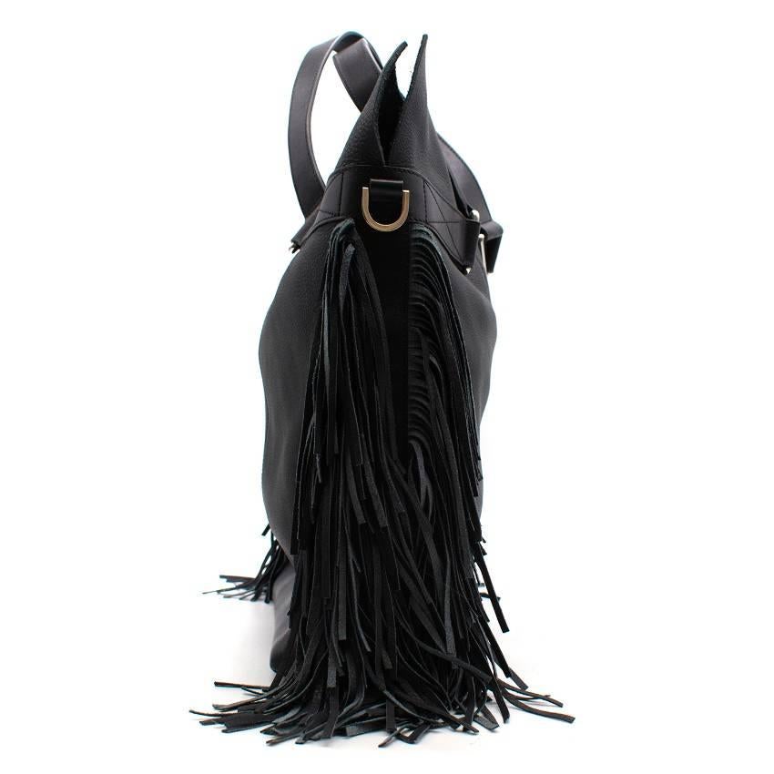 Max V. Koenig Aquila black leather tote bag - Current season

Featuring:
-fringe detailing
-top handle
-adjustable and detachable crossbody strap
-one interior zipped compartment
-protective bottom studs
-written designer logo on the bottom

Approx.