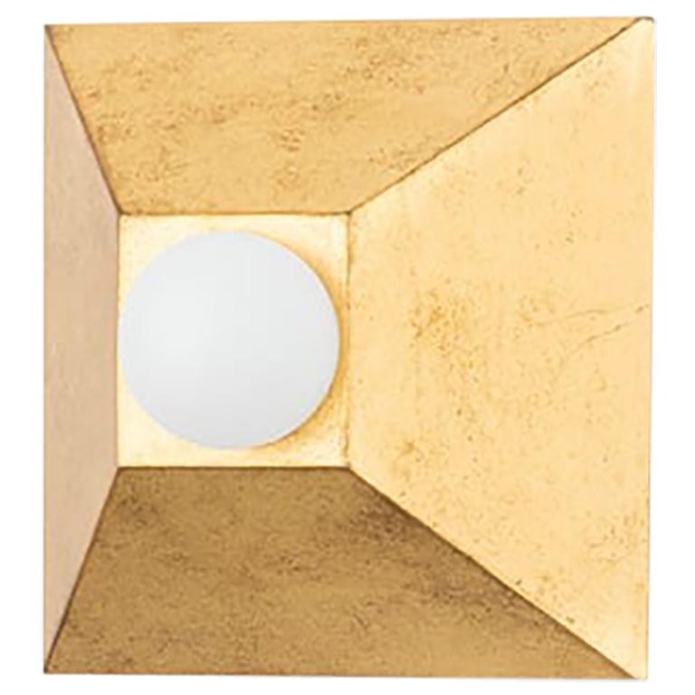 Playing with shapes. 
Max gives simple geometry, maximum style.
A series of pyramid bases, supporting round globe lights, come together to form squares and rectangles.
The vintage gold or silver leaf finishes, add to the design's overall Hollwood