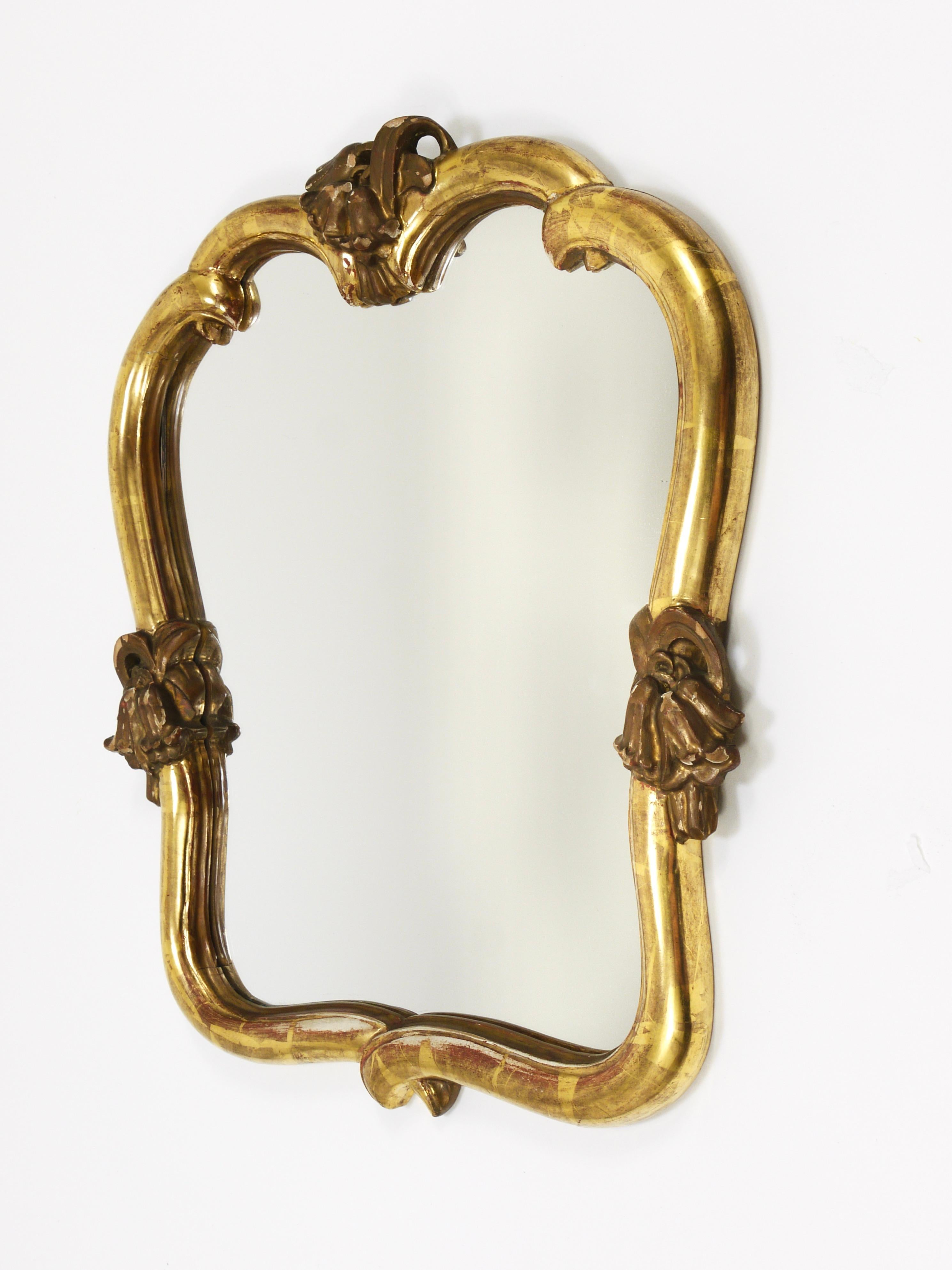 A beautiful and rare Art Nouveau wall mirror from the 1930s, designed by Hans Welz for Max Welz, Vienna. Hans Welz, the nephew of Max Welz, was a student of Josef Hoffmann and also worked for the Wiener Werkstätte. The mirror is crafted from carved,