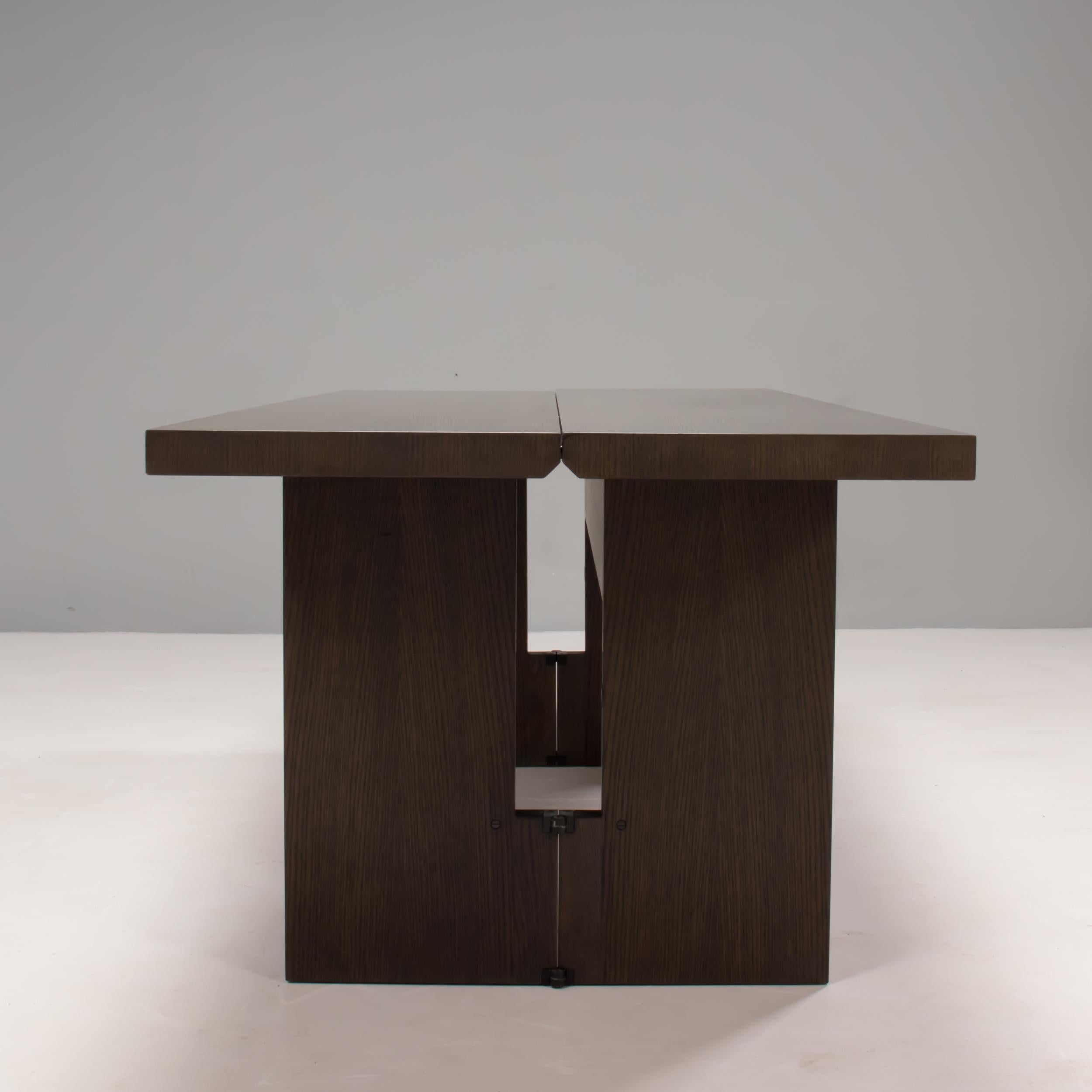 Designed by Antonio Citterio for Maxalto, the Sibilla table is a versatile piece of modern design which allows for multiple uses.

Constructed from solid oak, the table top is split into two leaves with hinges along the centre line. When fully