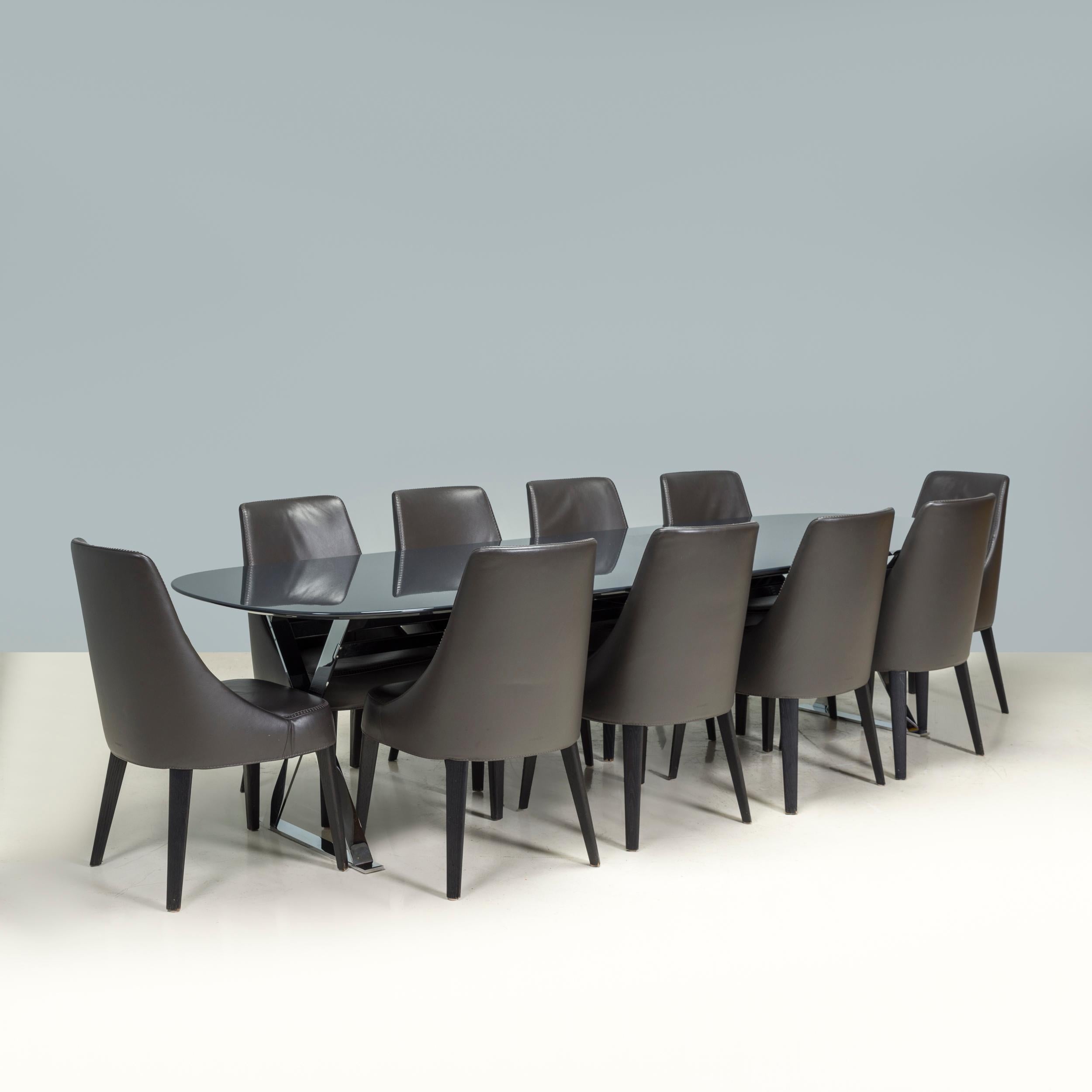 Originally designed by Antonio Citterio for Maxalto B&B Italia in 2008, the Febo dining chair is a fantastic example of modern Italian design. 

The chair is constructed from a tubular steel frame and are finished with dark stained wooden legs,