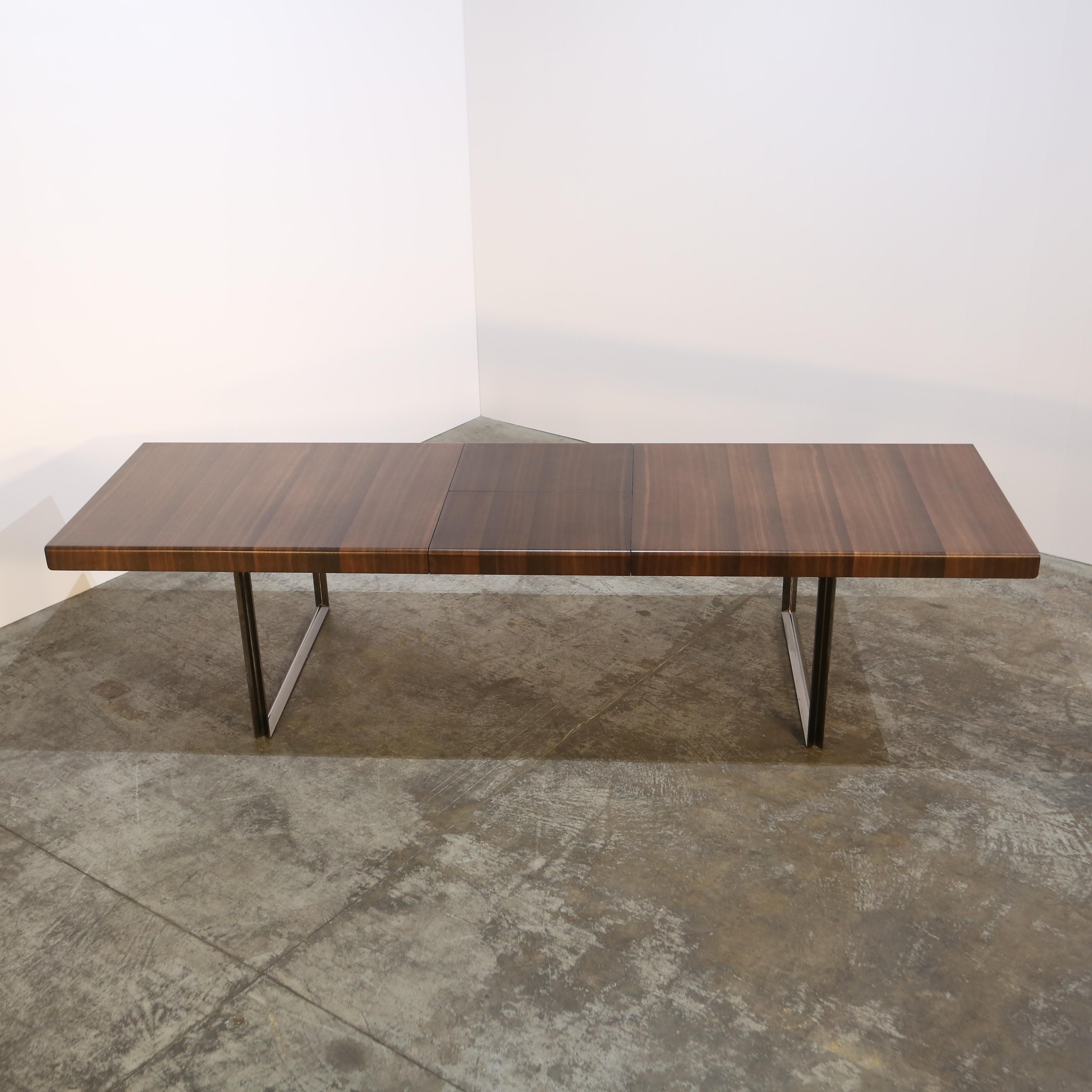 Introducing the Recipio Dining Table by renowned designer Antonio Citterio for Maxalto. This stunning piece features a sleek and modern design, with a rectangular top crafted from luxurious wood. Perfect for hosting intimate dinner parties or large