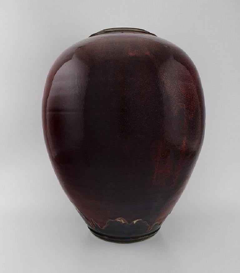 Maxence Jourdain. French contemporary ceramicist. 
Colossal unique floor vase in glazed stoneware. 
Beautiful ox blood running glaze. Dated 2004.
Measures: 50 x 40 cm.
In excellent condition.
Signed.