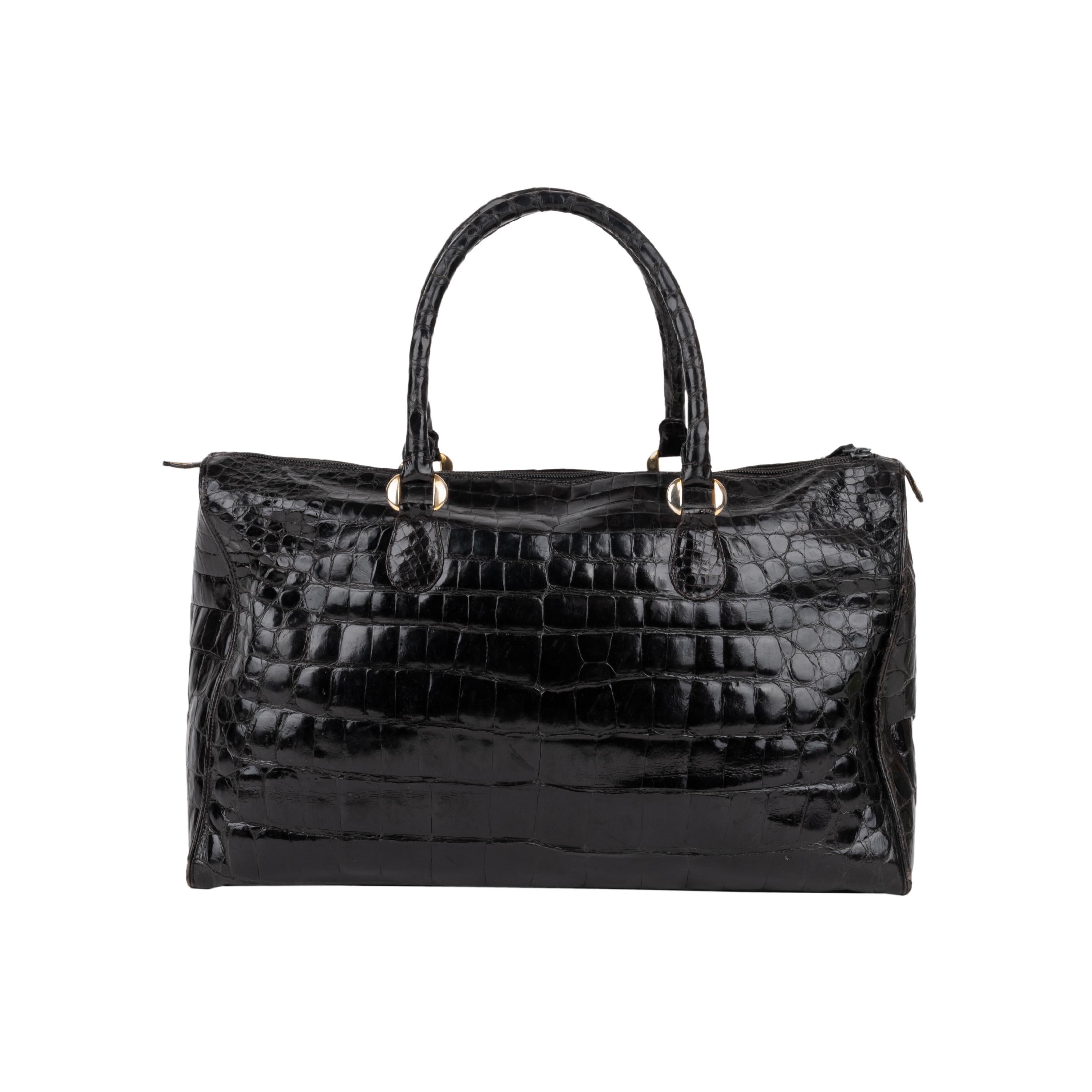 Collection Privée black crocodile leather bag. Maxi style with two internal pockets. 

Height:18; Width:25; Depth:12;