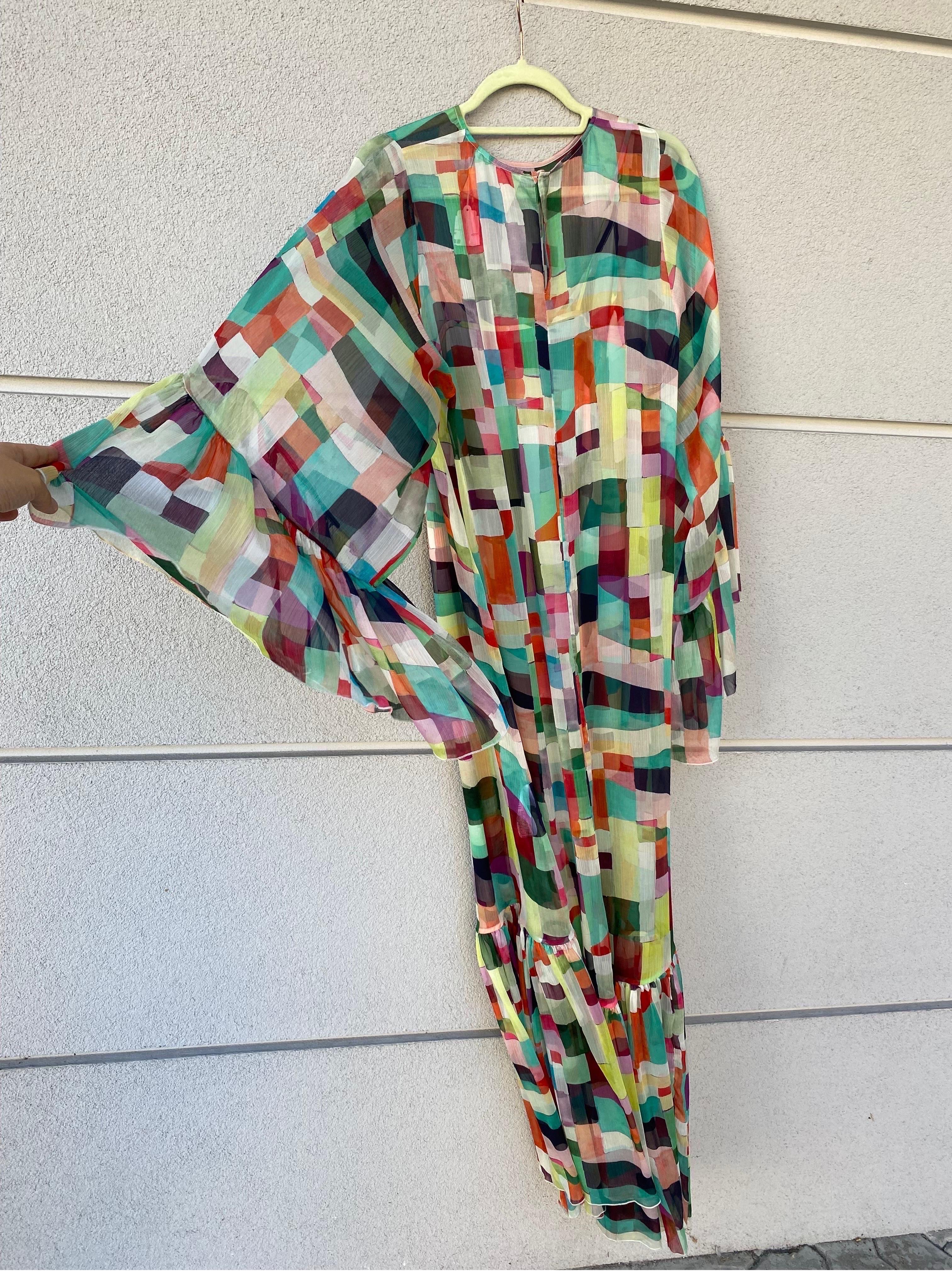Erika Cavallini long patterned dress 
Made of polyester. Maxi model dress. Transparent.
Dress with slip (slim dress) that can also be used as a mini dress. 
Size 40.
Petticoat bust 42
Suit: 
Shoulder 40
Sleeve length 70
Length 110
Bust 97.
In