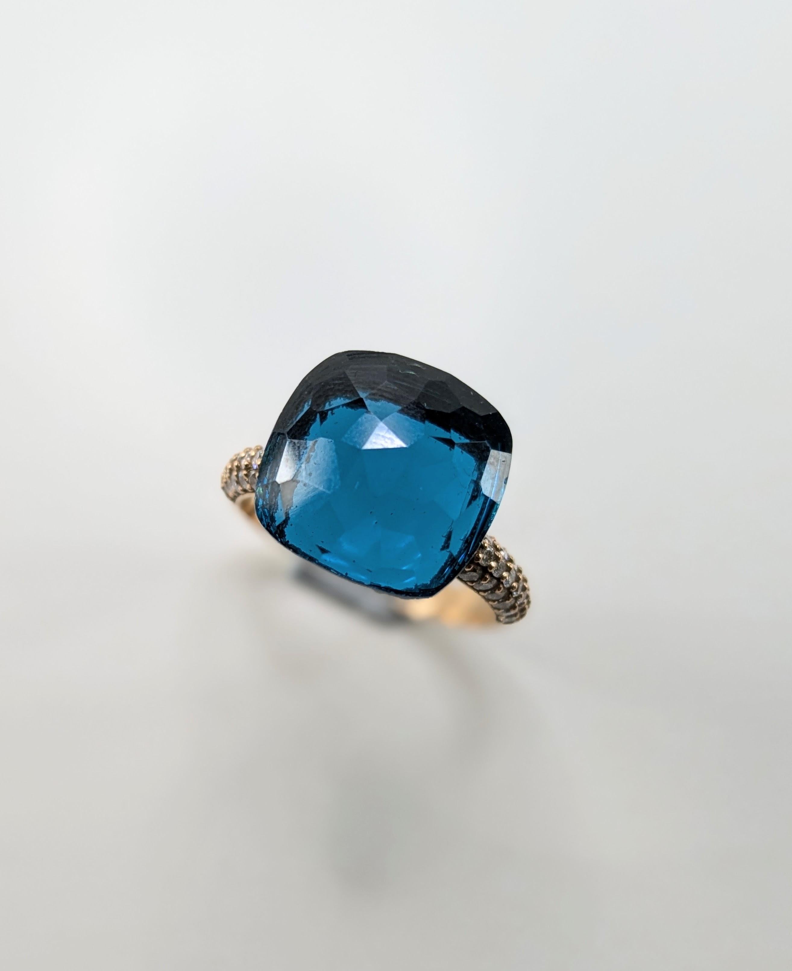  XL Topaz Blue London in  18 Karat  Gold Ring with Pavé of Diamonds
Diamonds 0,41 ct
Gold weight  5,78 grams
Ring Weight  9,3 grams
Size 16
Can be resized. Made to order. 
Gold finishes in Yellow, Rose or White 18k Gold 
 Nudo  stone, available in a