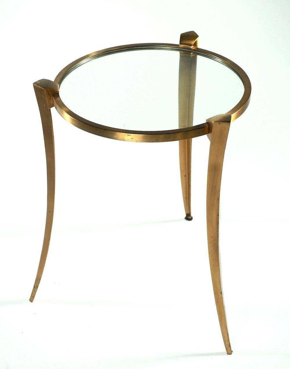 French, circa 1960, bronze and glass side table by Maxime Old. Superb original condition. Measures: 18.5” diameter x 23.5” high.