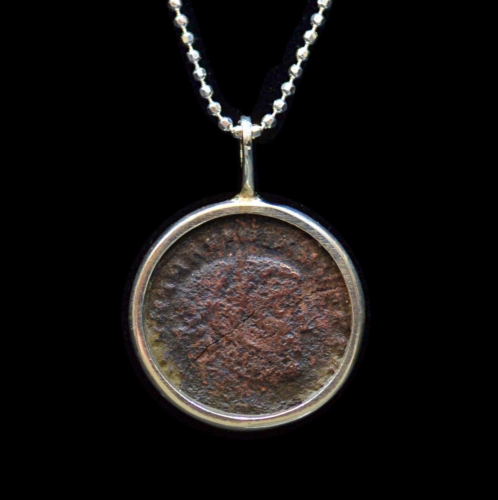 Antique roman bronze coin mounted on contemporary silver necklace. Ready to be worn!

Maximianus, emperor of Rome from 286-305 AD

Caesar from 285 to 286, then Augustus from 286 to 305. He shared the latter title with his co-emperor and superior,