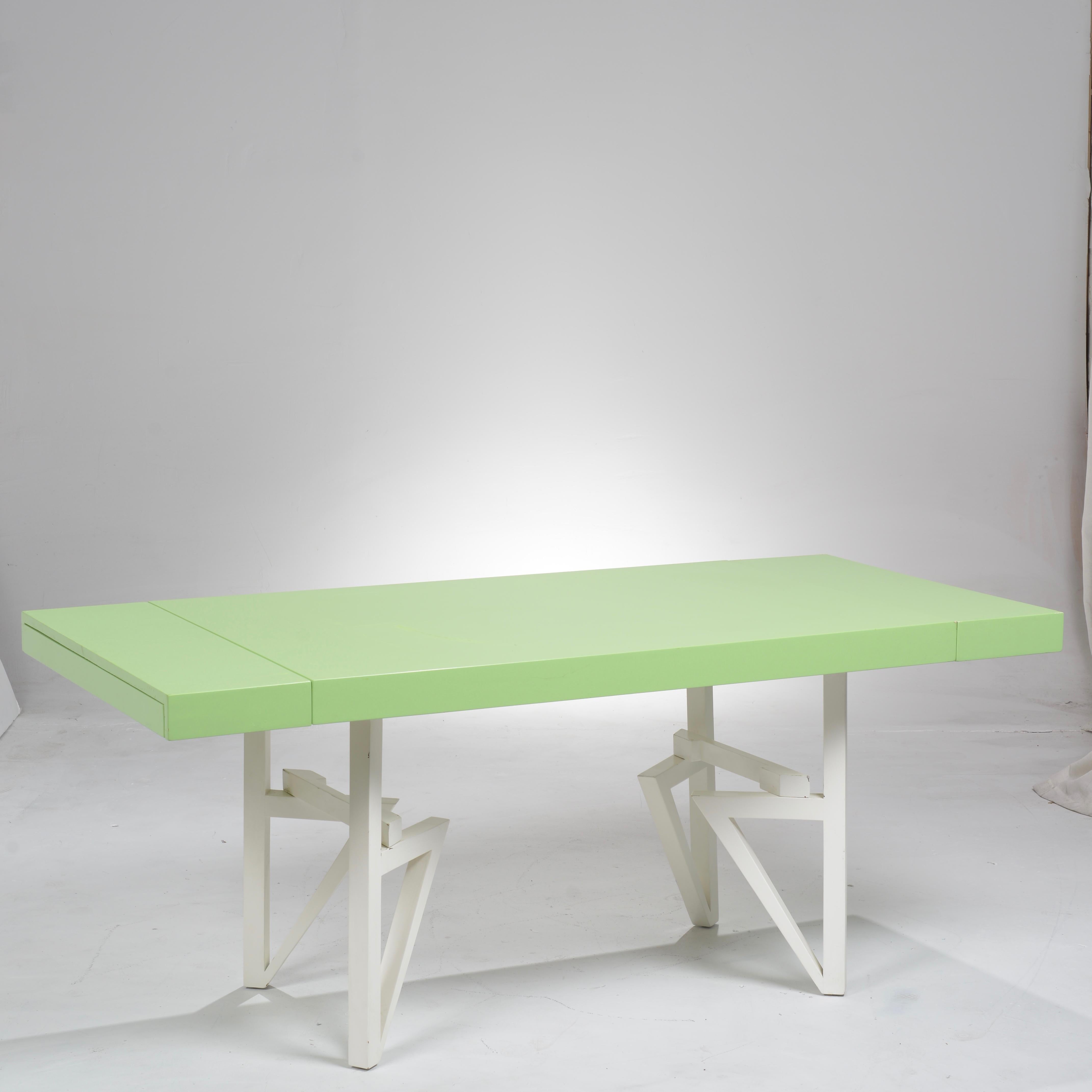 Maximilian Karp/ Maximilian for Karp, green lacquered geometric dining table. This unique and rare design was manufactured by Karp Furniture Company Los Angeles. This table is adjustable and comes with two (2) leafs to extend the table length. 